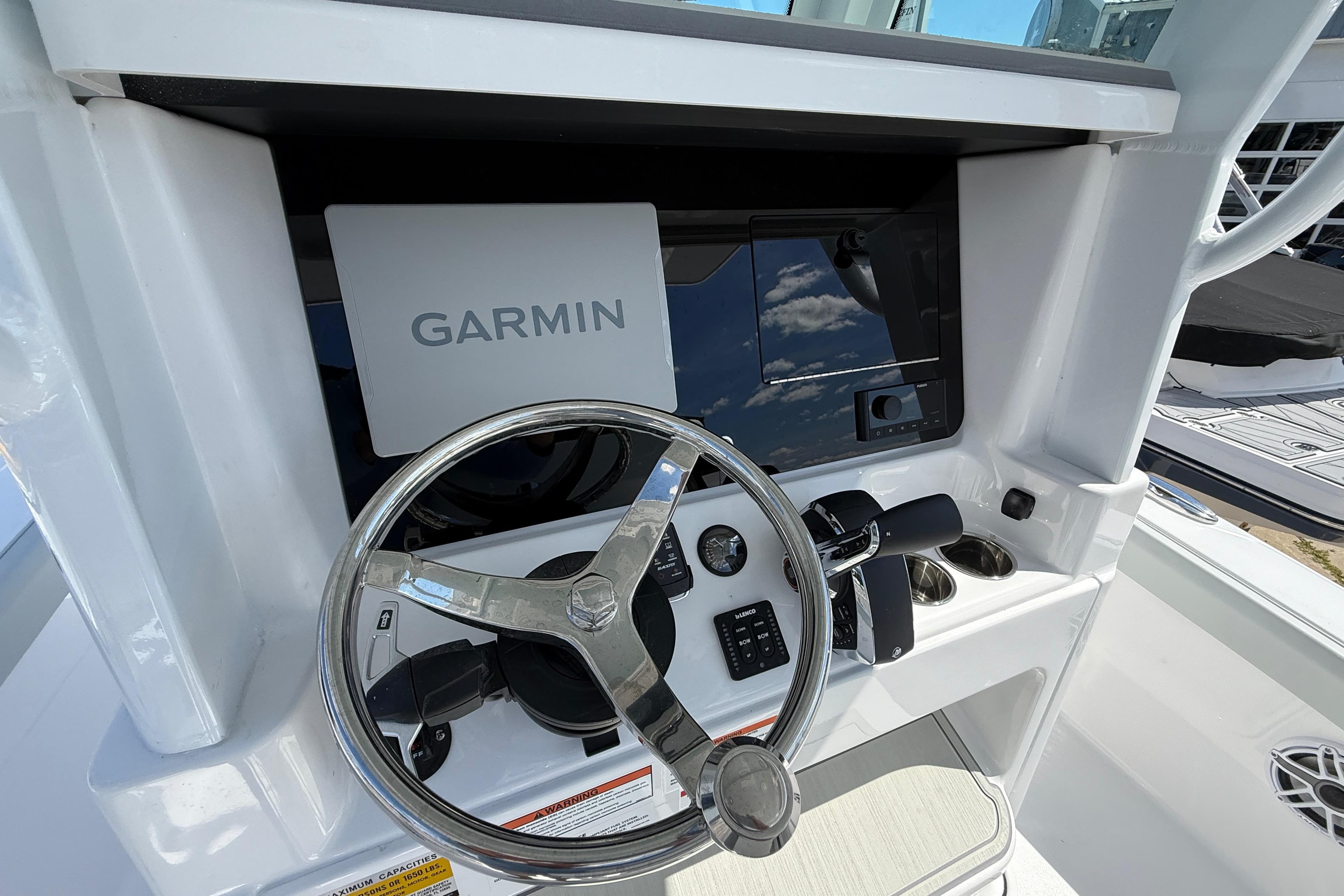Steering console of 2026 Blackfin 242 HB boat with Garmin navigation system.