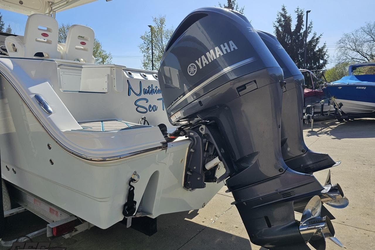 2013 Sea Fox 286 Commander boat with Yamaha outboard engines, parked outdoors.