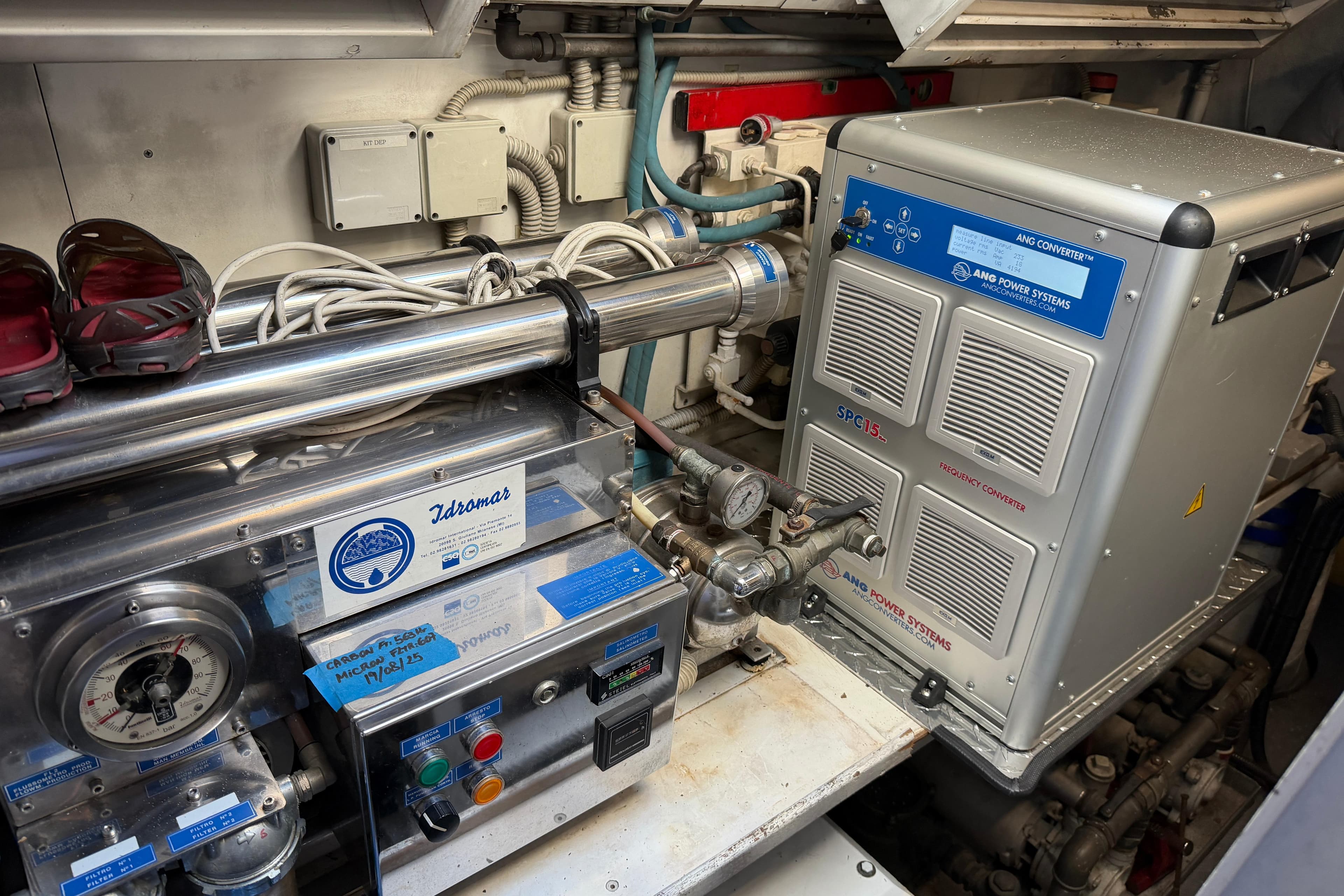 Engine room of a 2004 Mangusta 72 yacht featuring power systems and equipment.