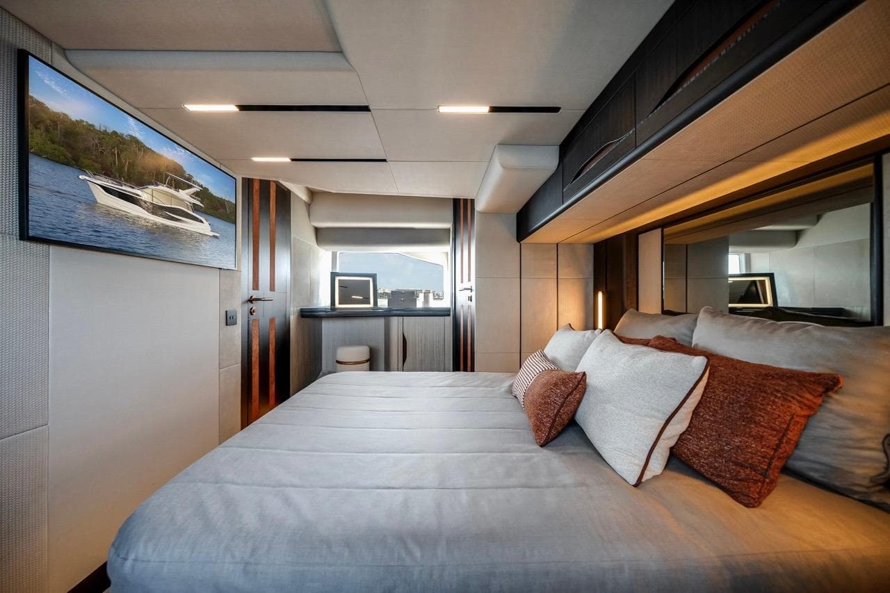 Luxurious bedroom interior of 2026 Galeon 520 Fly yacht with modern decor.