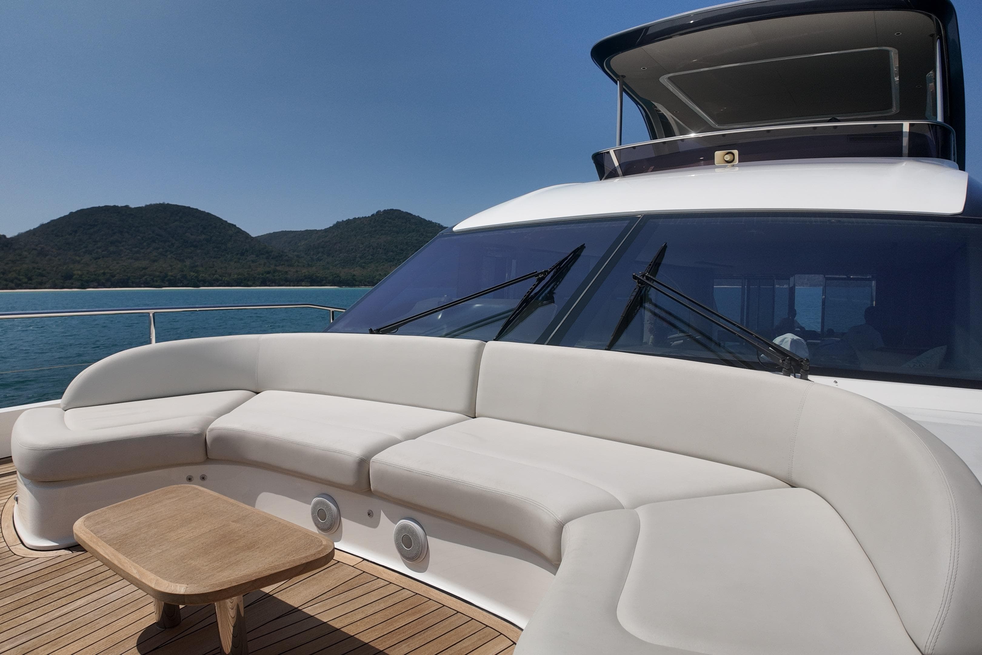 Luxurious 2023 Princess Y72 yacht deck with elegant seating and scenic ocean view.