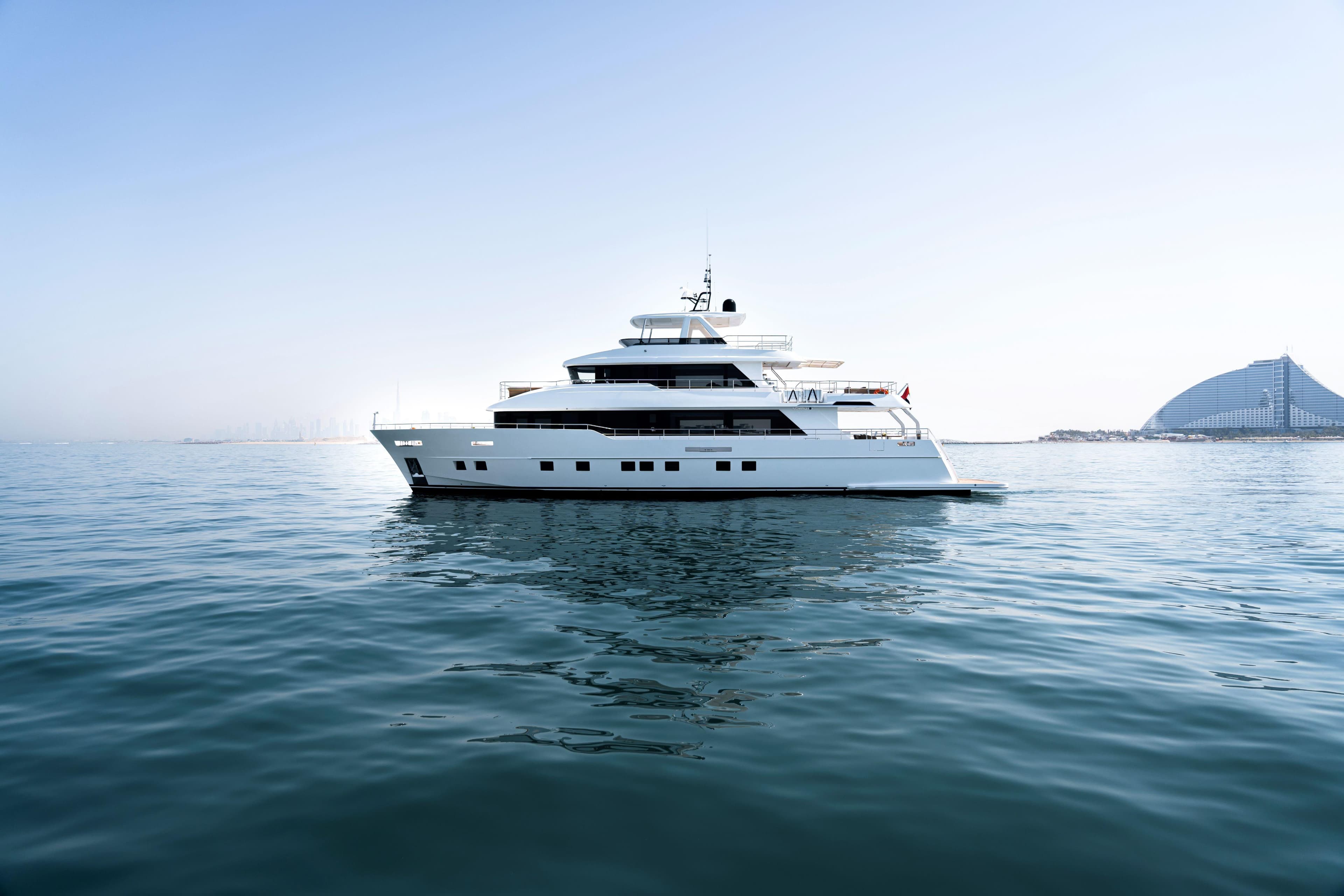 Luxurious Nomad 101 yacht cruising on calm waters, 2025 model.