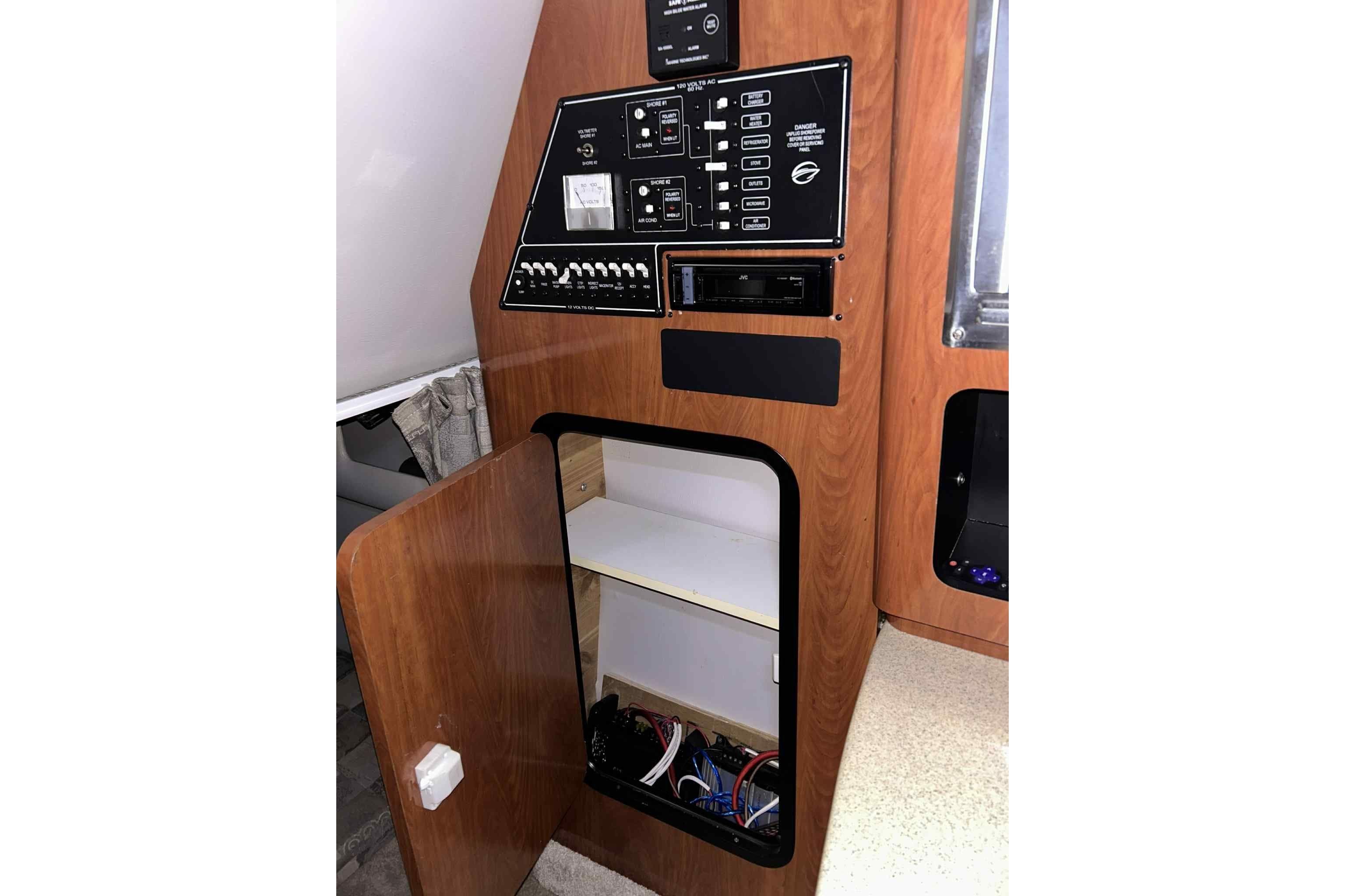Control panel and storage compartment inside a 2011 Crownline 280 CR boat.
