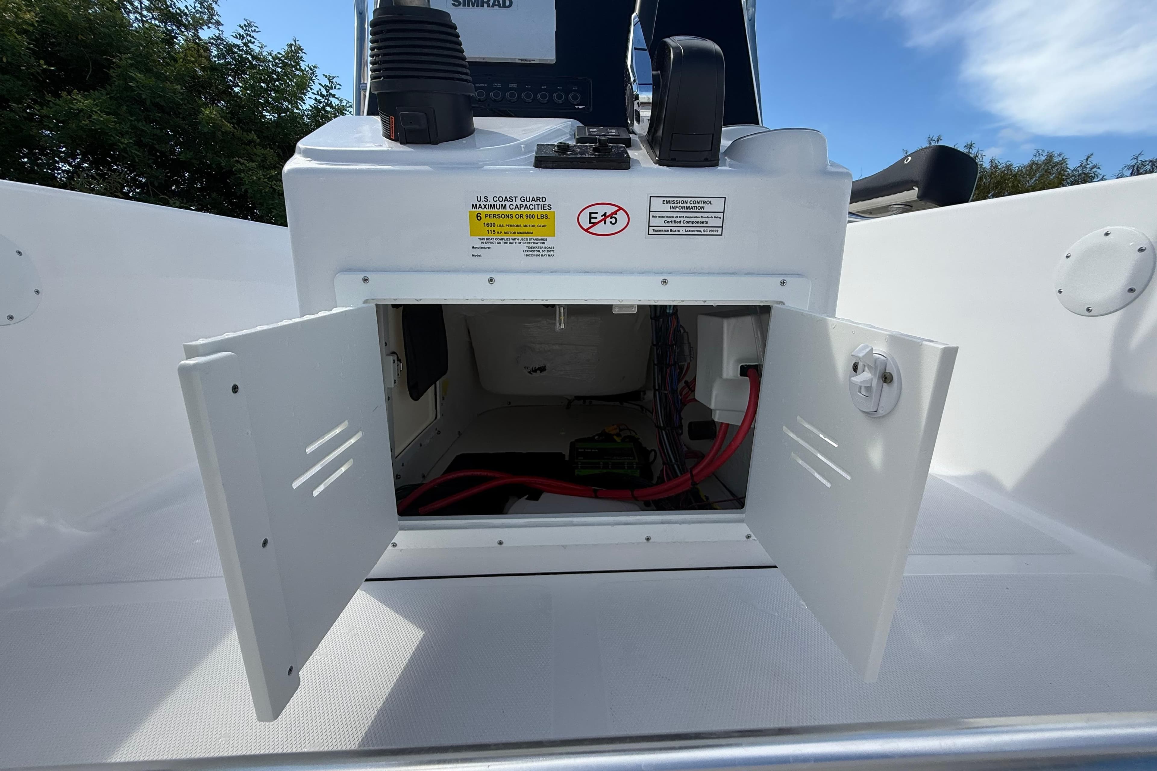 2026 Tidewater 180 CC Adventure boat console with open storage compartment and visible wiring.