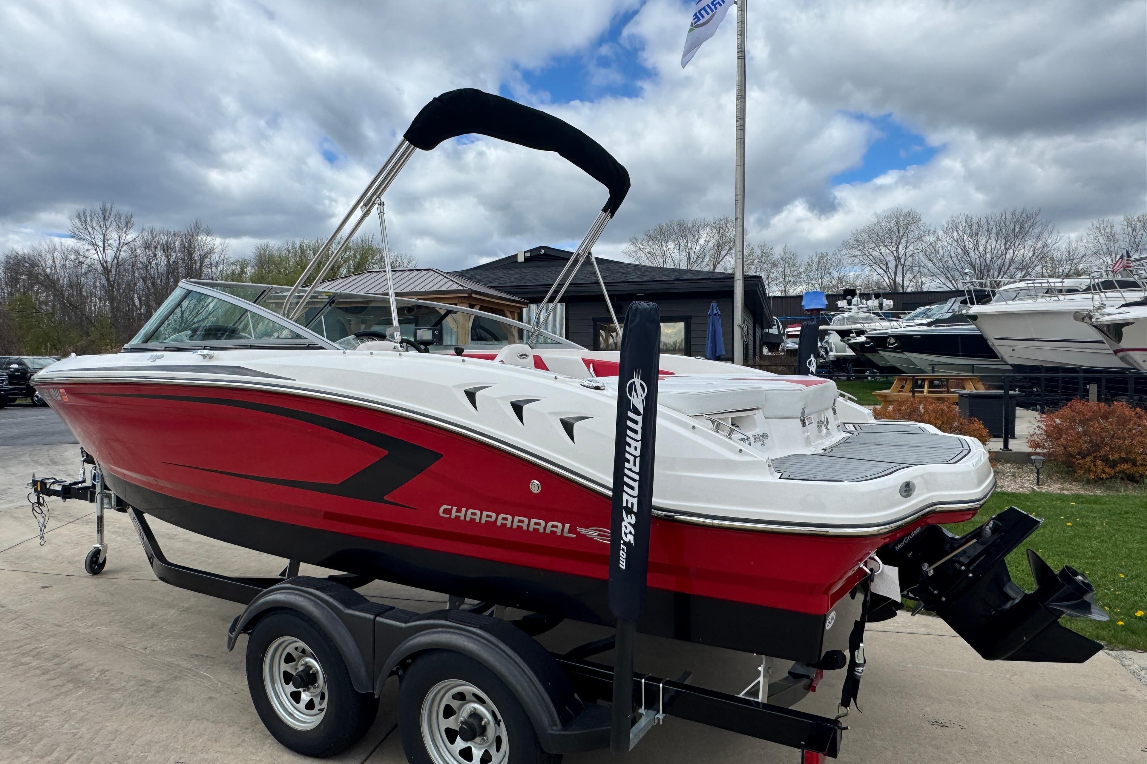 2017 Chaparral 21 H2O Sport boat in red and white on trailer.
