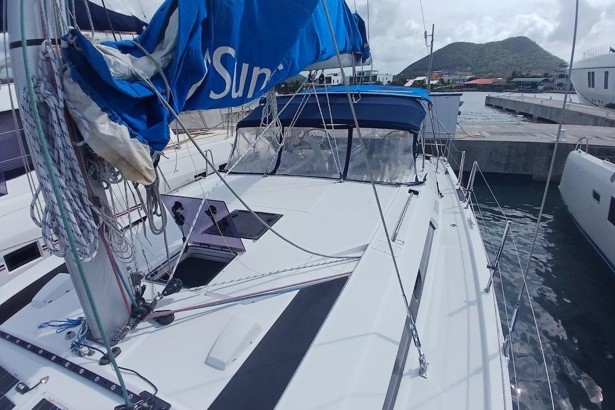 2020 Beneteau Oceanis 46.1 sailboat docked, featuring blue sail cover and spacious deck.
