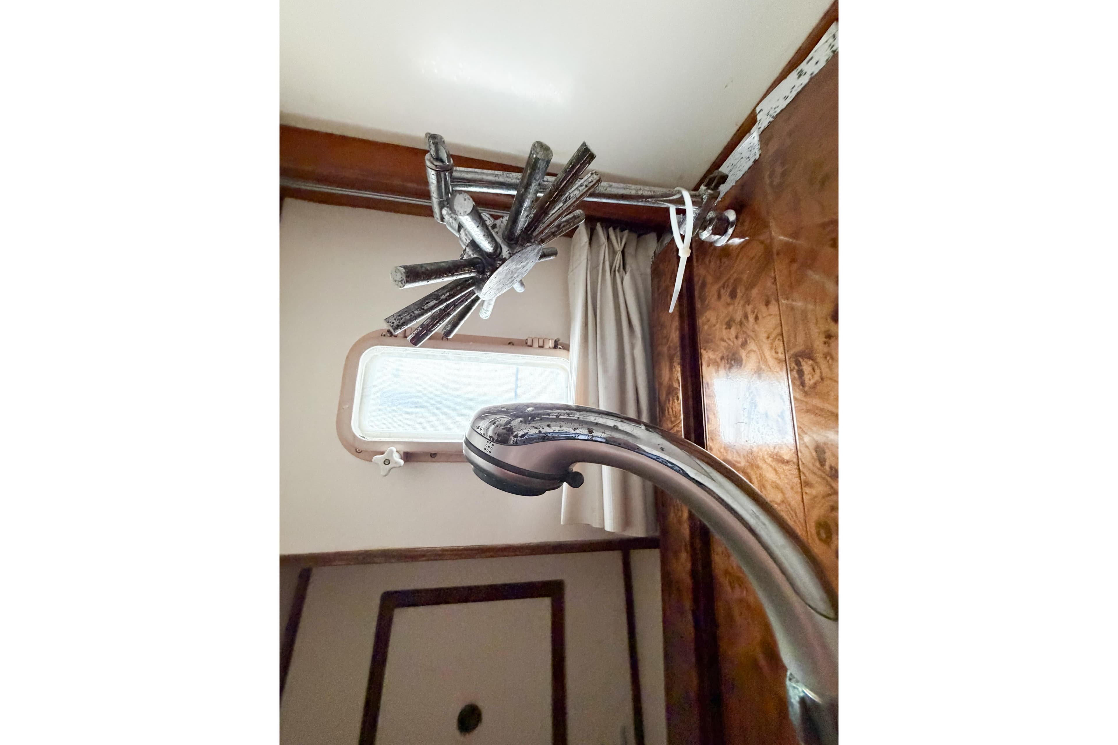 Interior of 1989 Jefferson Marquessa 52 yacht, featuring a unique faucet and window.