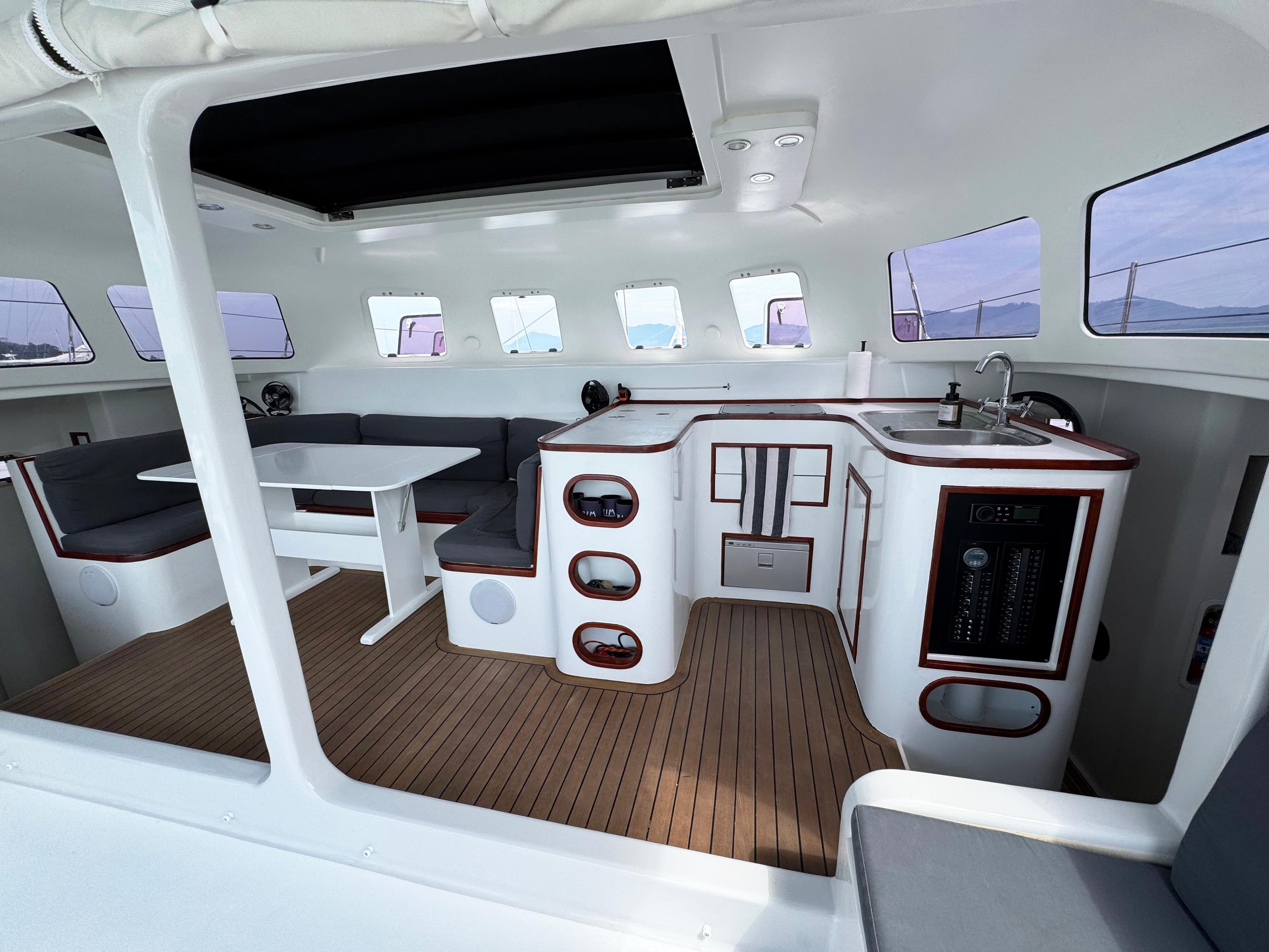 Interior of 2011 Andaman Cabriolet 39 yacht with seating, table, and kitchenette.