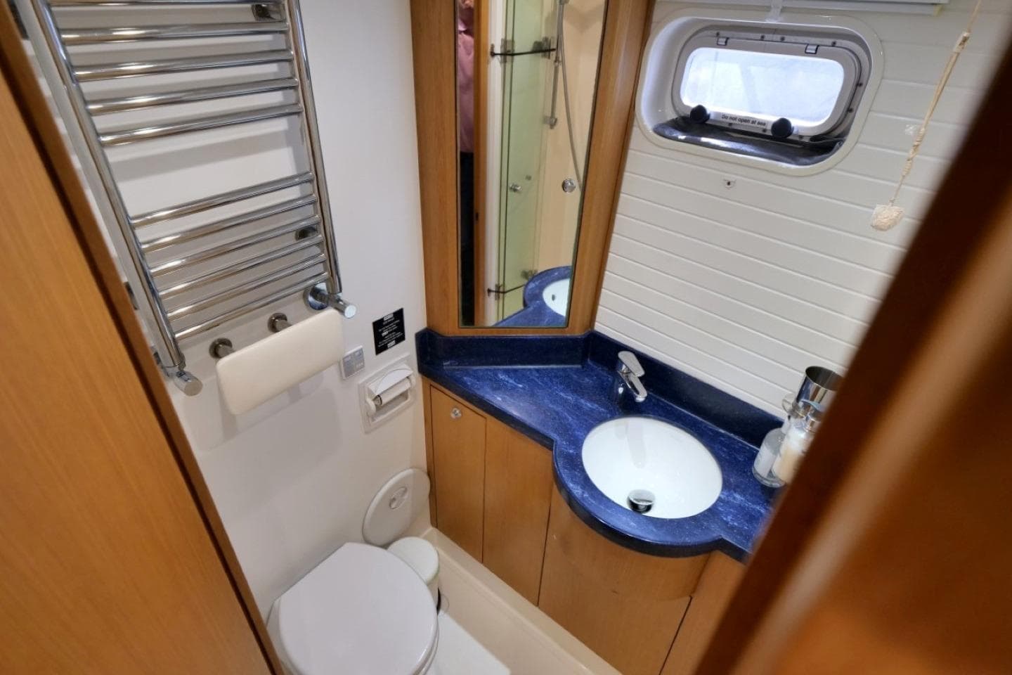 Bathroom interior of 2016 Bruce Roberts 16.5m Expedition Yacht, featuring modern fixtures and blue countertop.