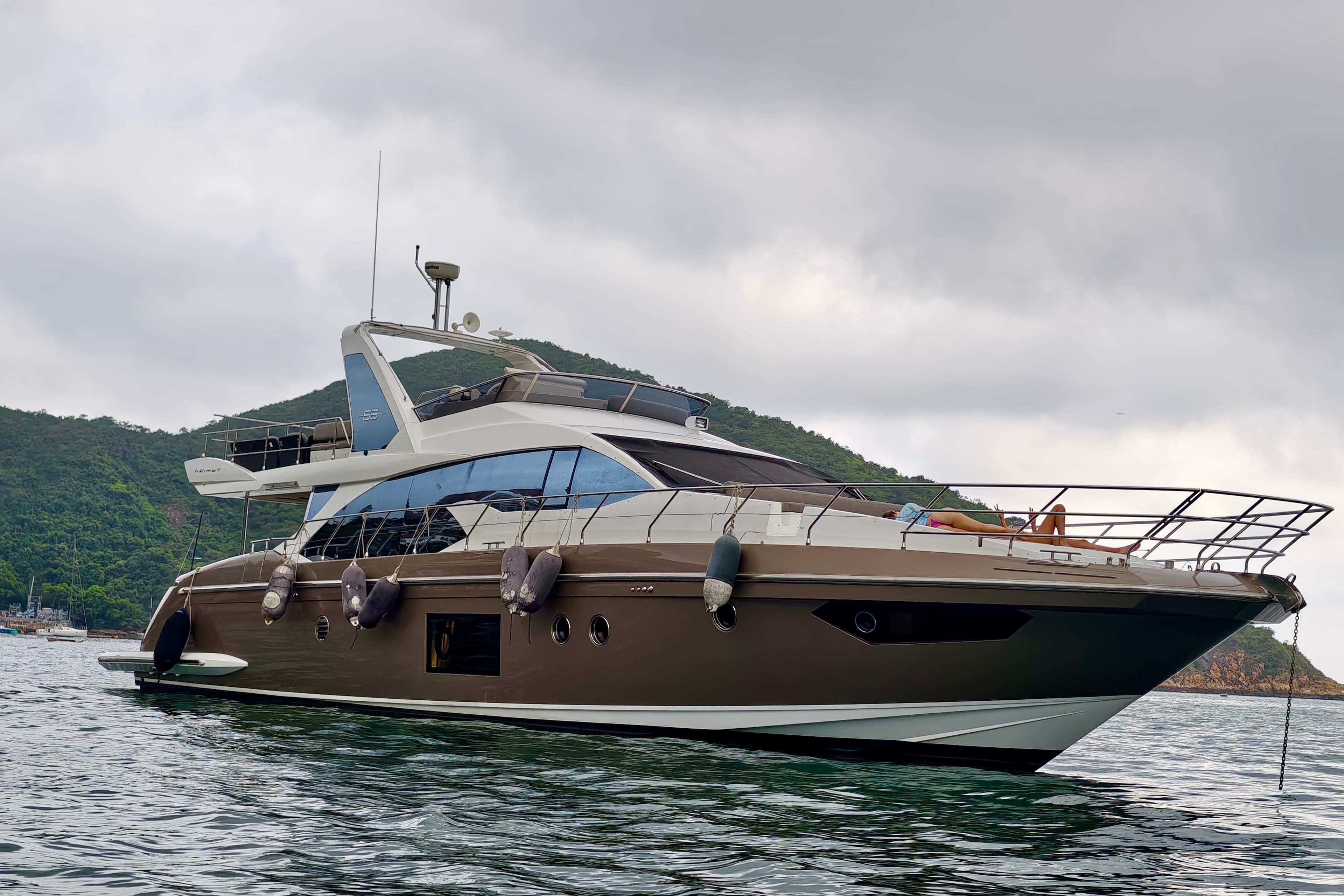 2017 Azimut AZIMUT 66 yacht on water, with scenic background.