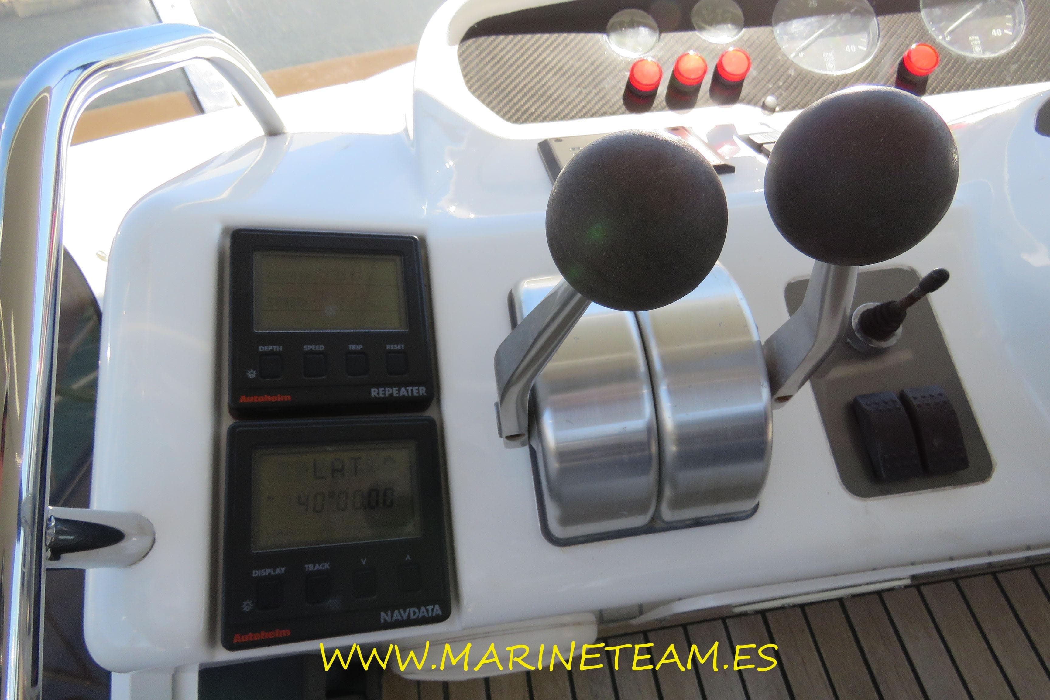 Control panel of a 1995 Princess 60 yacht with navigation instruments.