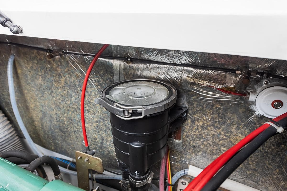 Engine compartment of 2000 Nimbus 380 Carisma with visible wiring and components.