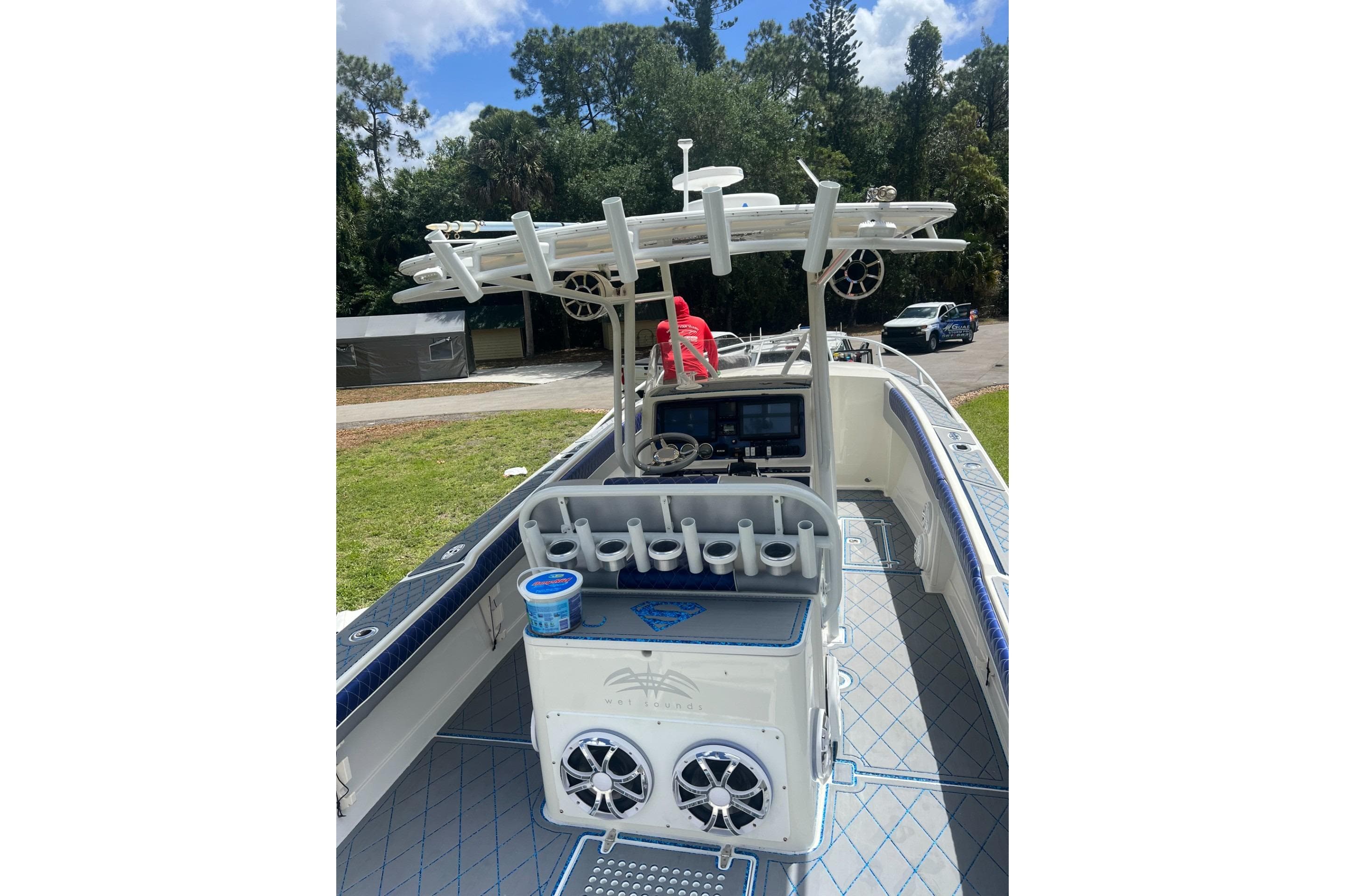 2004 Jupiter 31 Cuddy boat interior with fishing rod holders and navigation equipment.