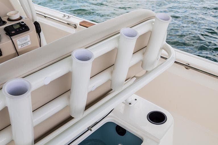 Manufacturer Provided Image: 2026 Boston Whaler 210 Montauk boat with rod holders and seating, on water.