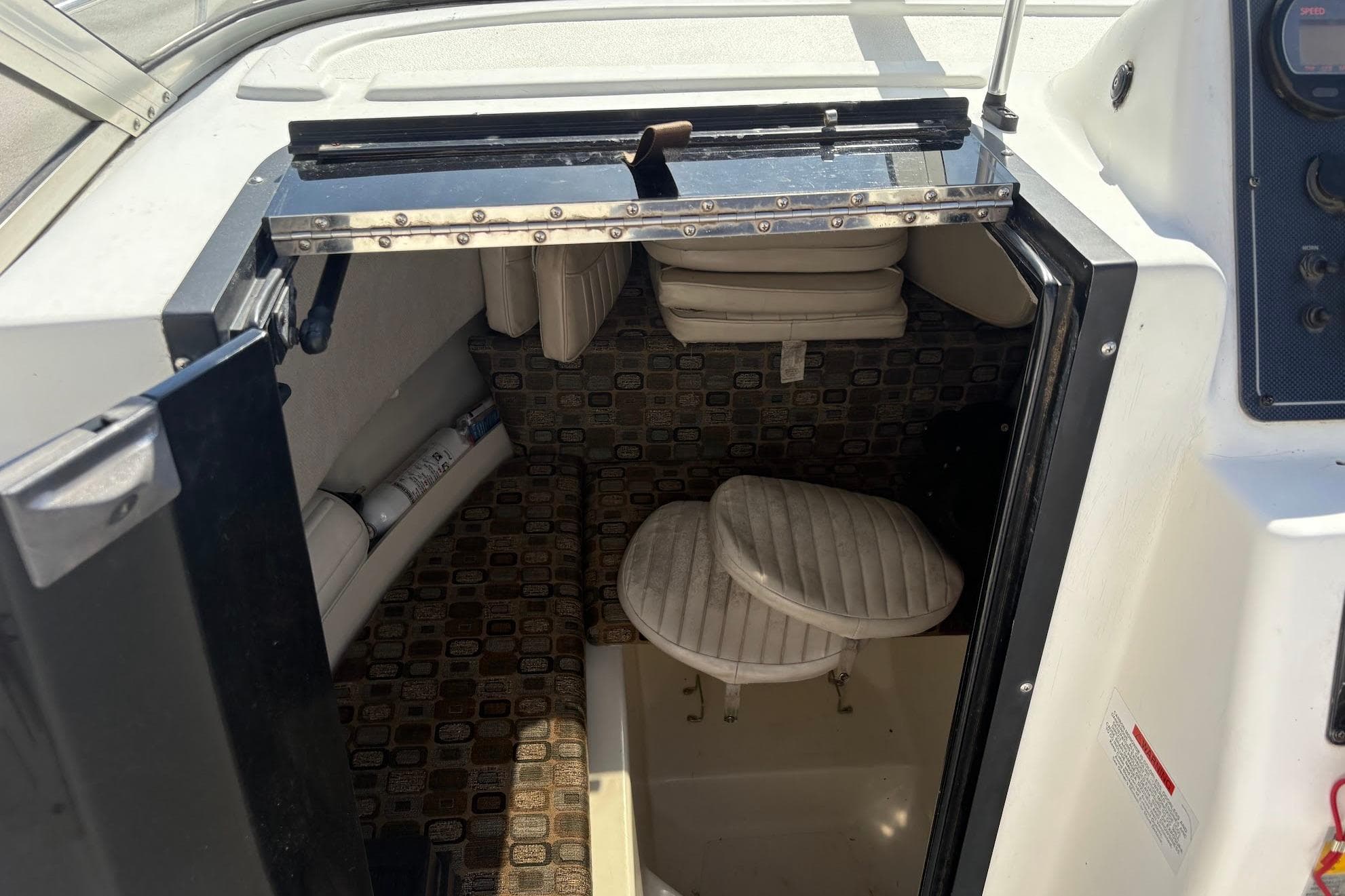 2002 Hydra-Sports 212 WA cabin interior with seating and storage compartments.