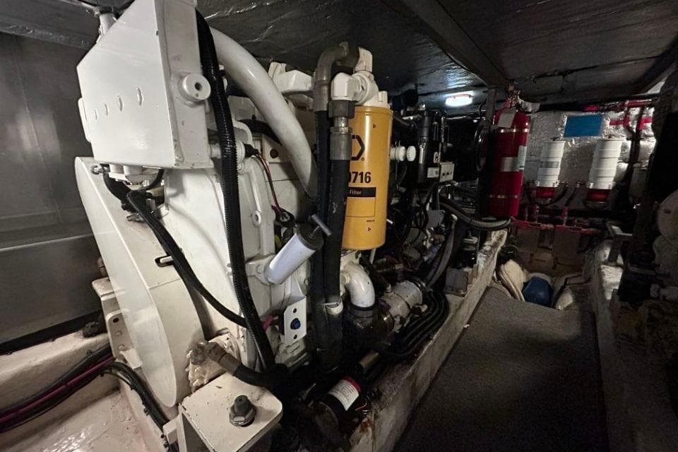 Engine room of a 2005 Hardy Commodore 50 yacht, showcasing machinery and components.