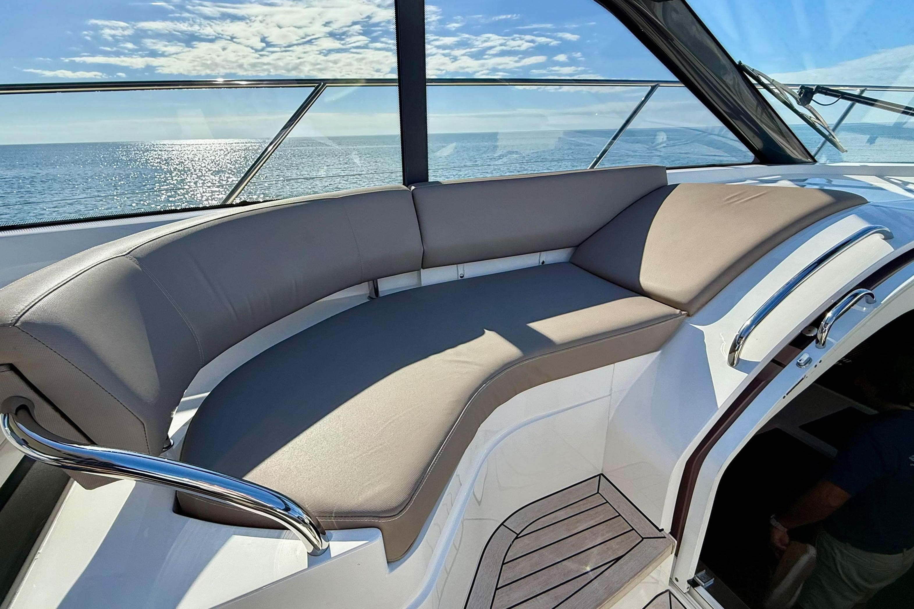 Luxurious seating on 2015 Princess V48 yacht with ocean view.