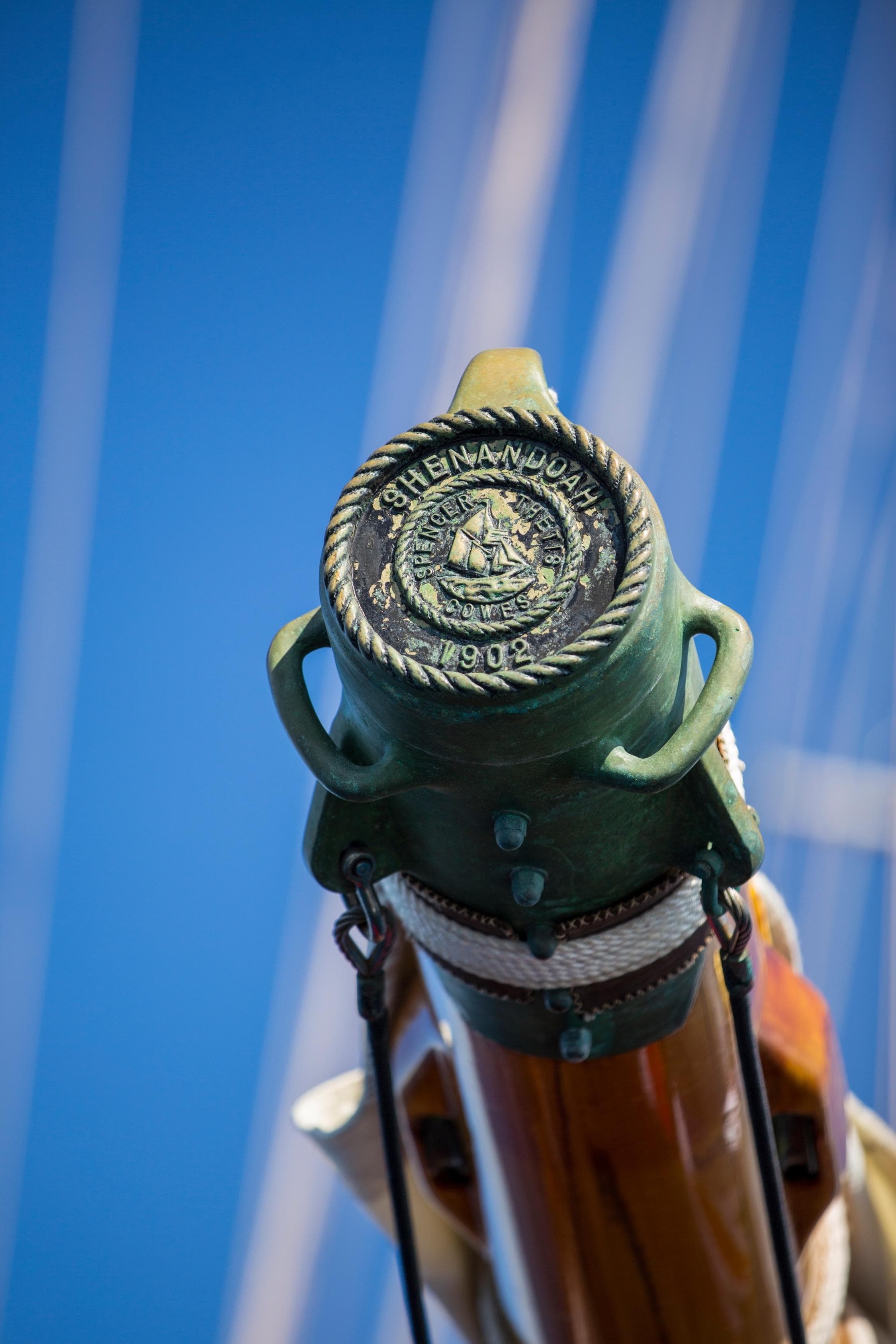 Close-up of 1902 Townsend & Downey Schooner masthead against clear blue sky.