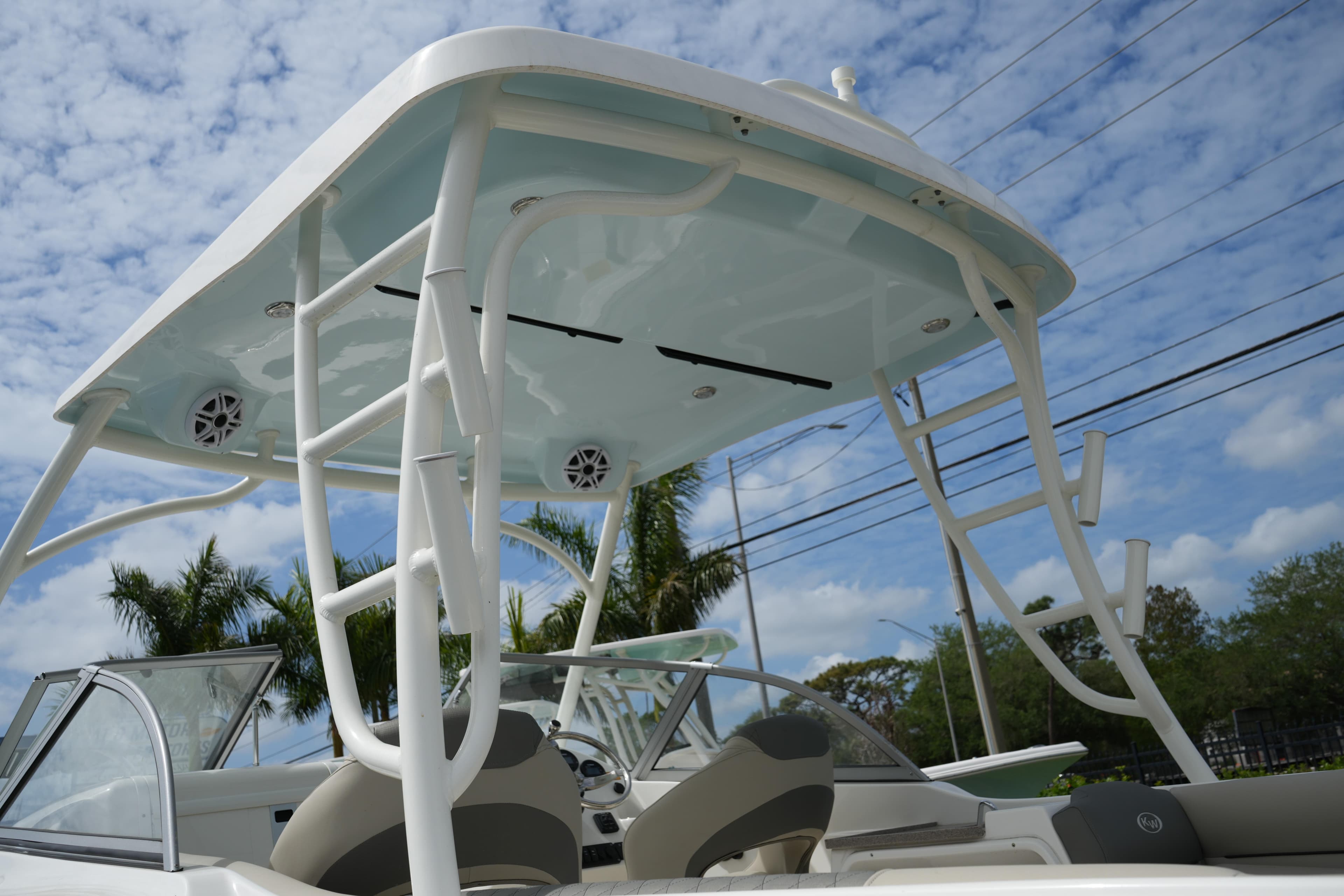 2026 Key West 239 DFS boat with T-top and speakers under a blue sky.
