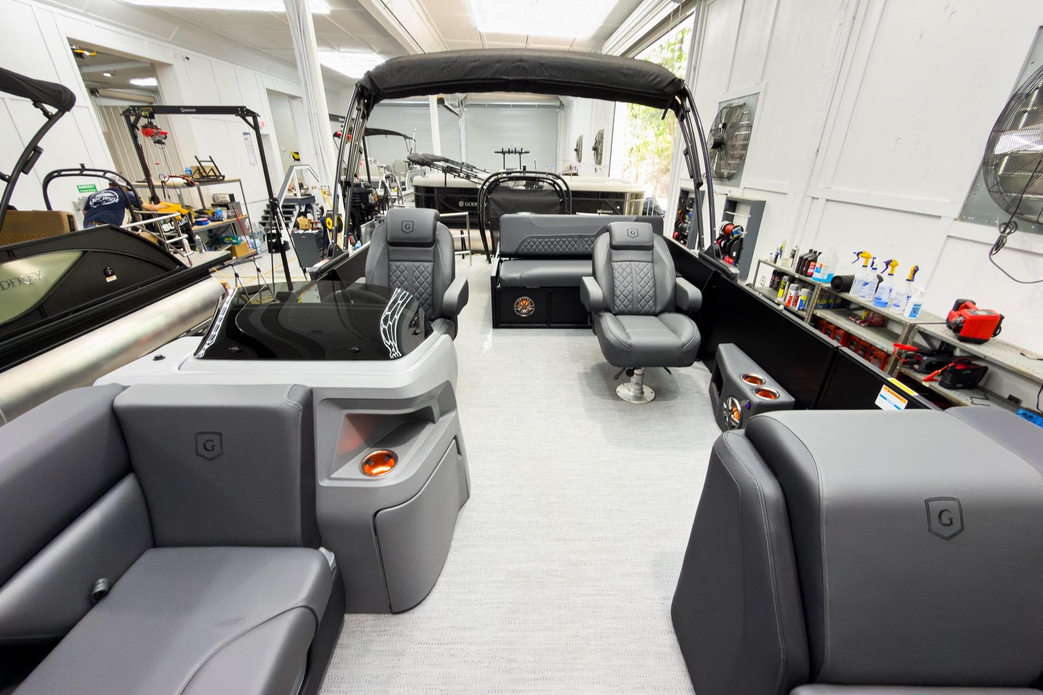 Luxurious interior of 2026 Godfrey Sweetwater 22' Tritoon with plush seating and modern design.