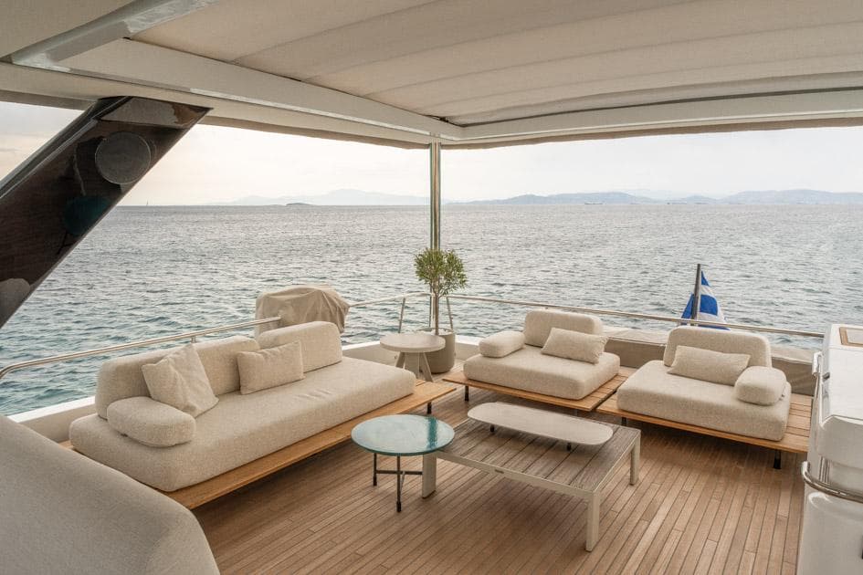 Luxurious deck of 2023 Lagoon 67 yacht with elegant seating and ocean view.