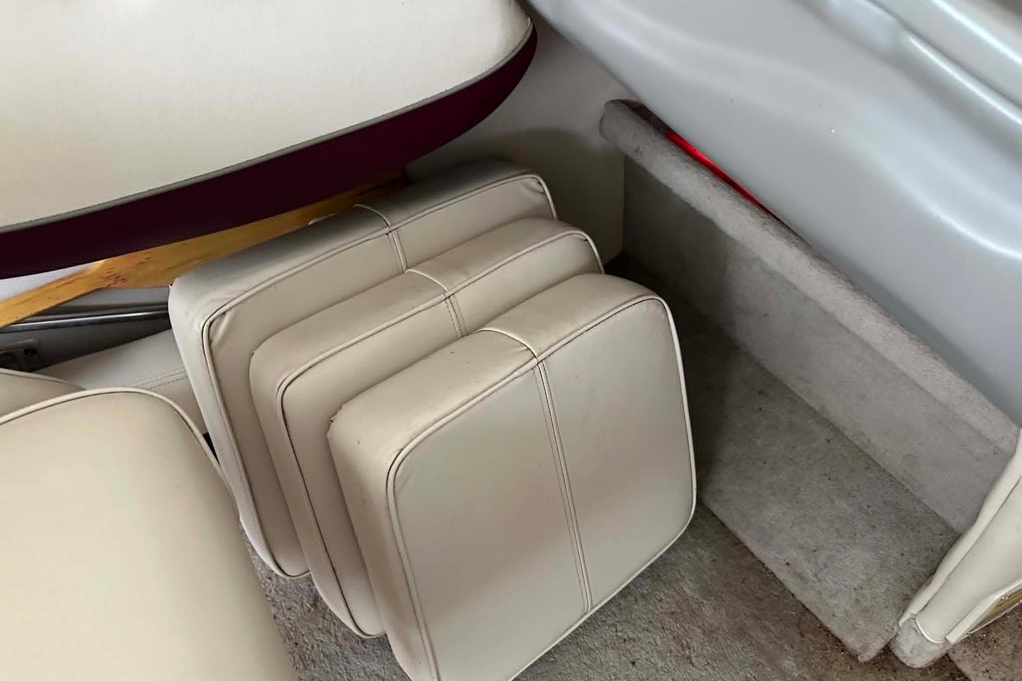 Cushions inside a 1998 Crownline 248 BR boat, showcasing interior seating arrangement.
