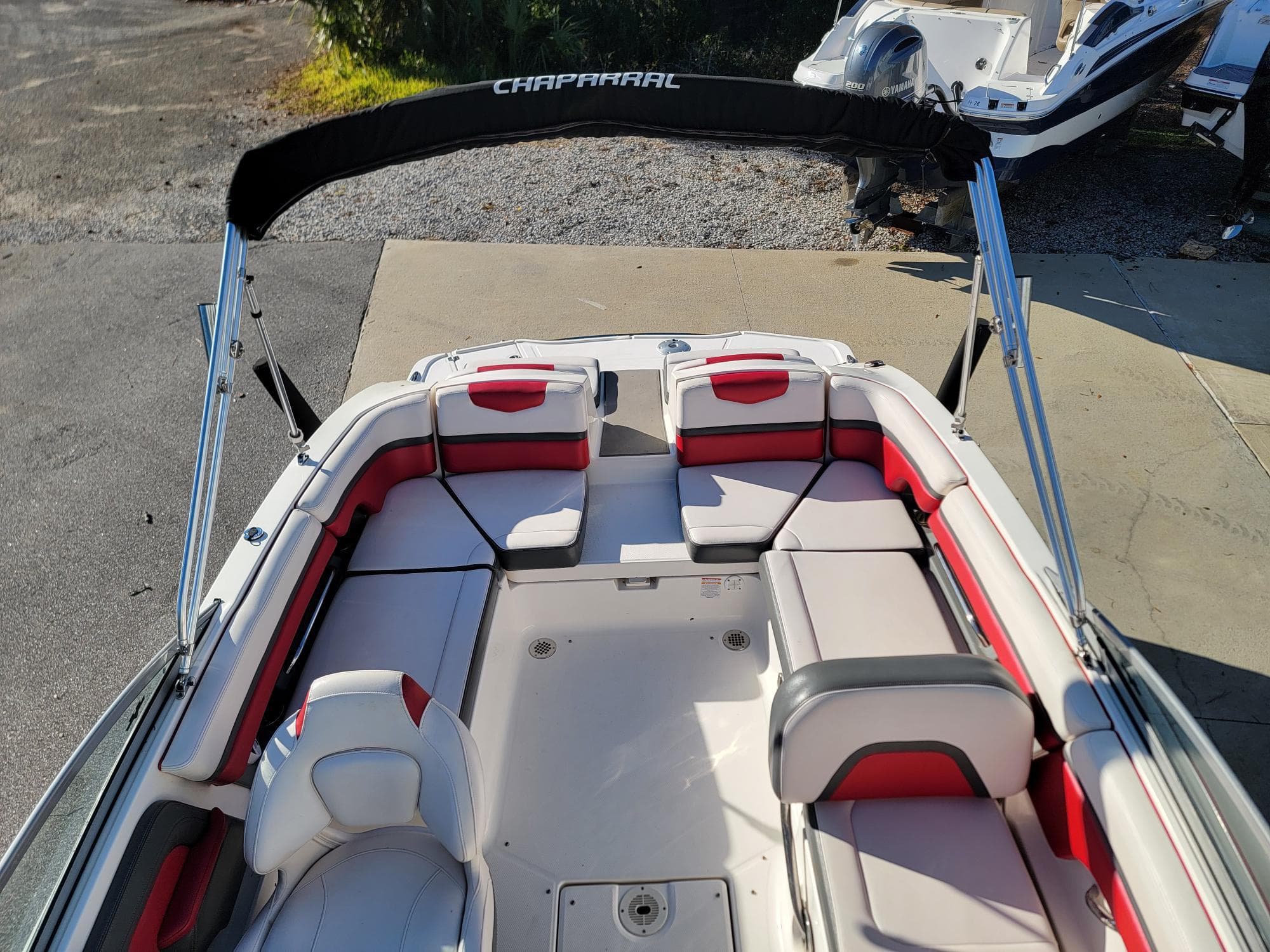 2016 Chaparral Vortex 223 VRX boat interior with red and white seating.
