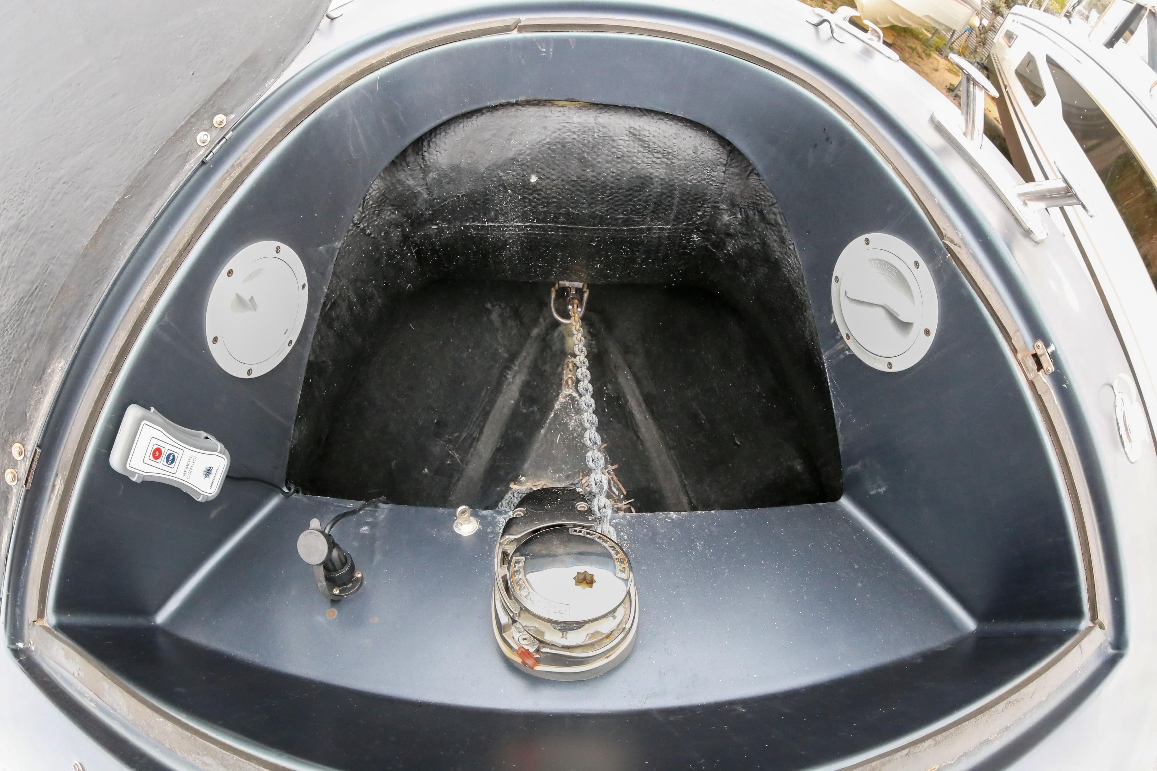 Anchor compartment of a 2019 Albatro 28 boat, featuring chain and control panel.