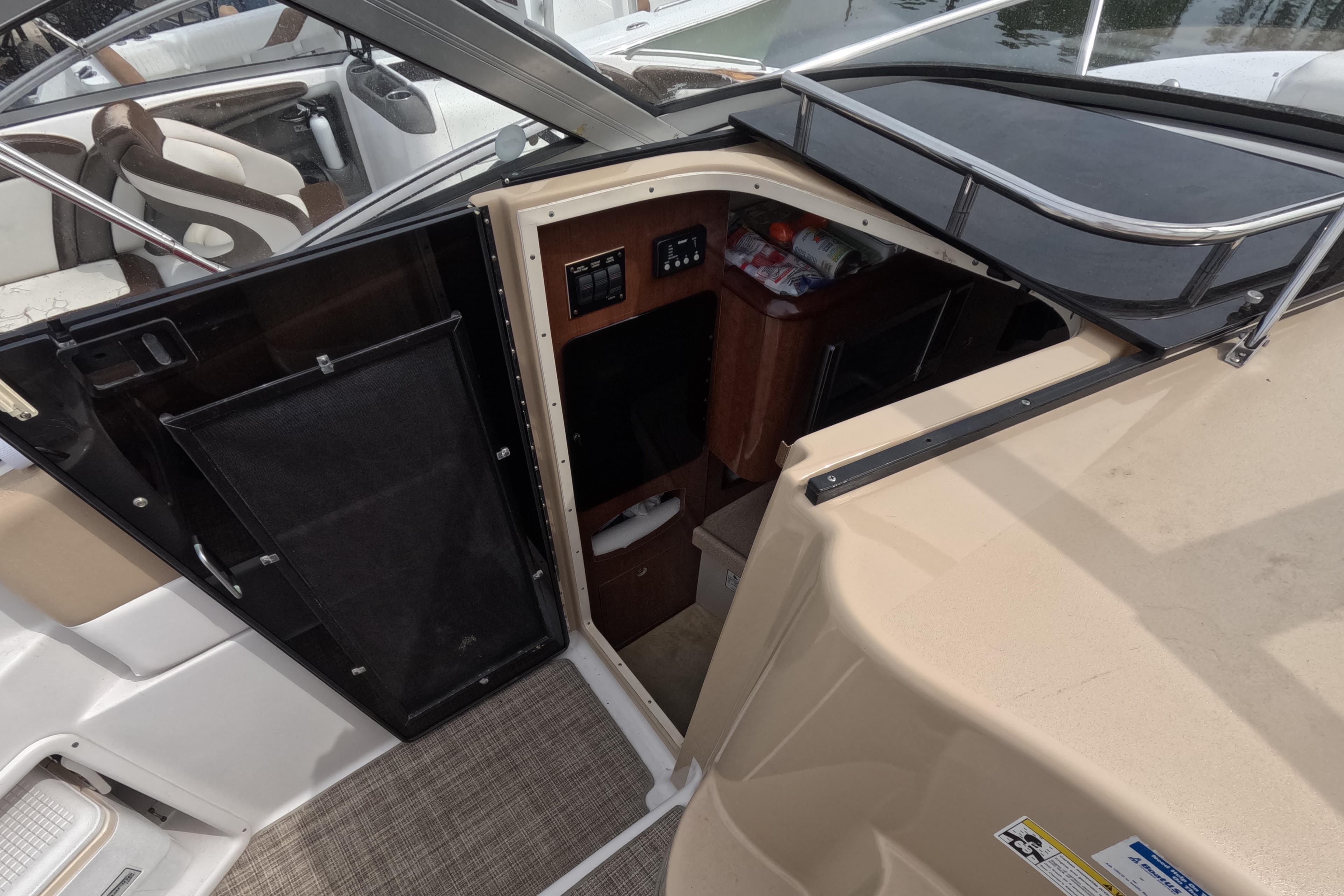 2012 Four Winns V265 boat interior with cabin entrance and seating area.