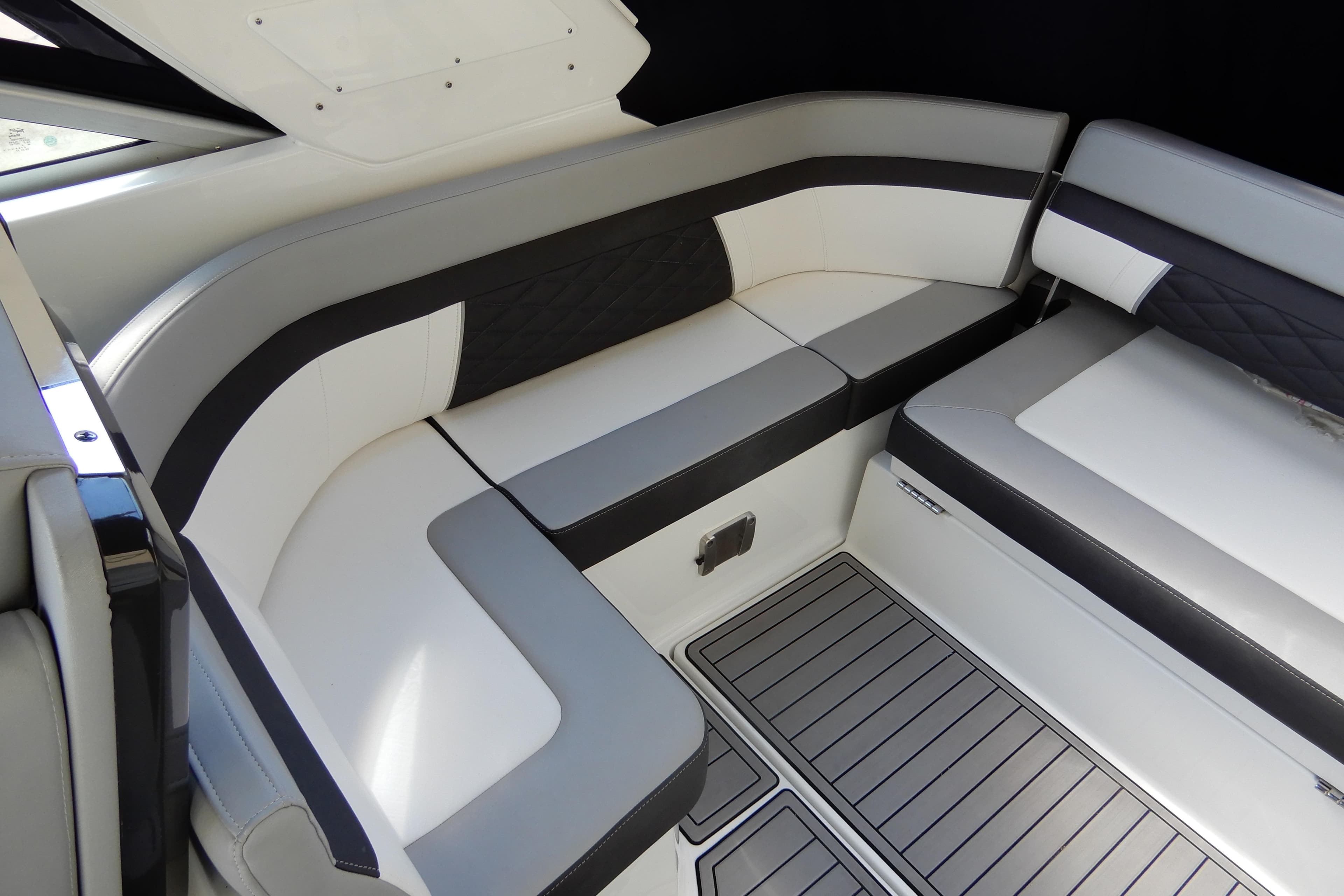 Luxurious seating area on 2022 Monterey 295 Sport Yacht with sleek, modern design.