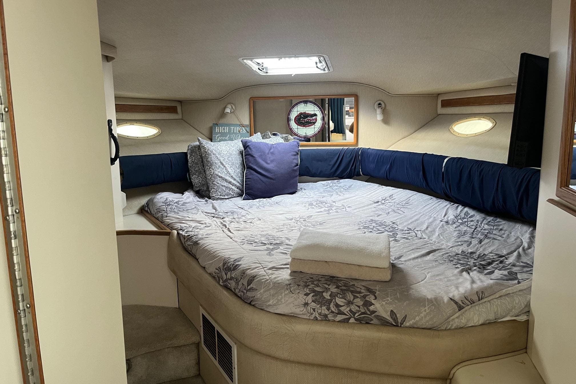 Cozy cabin interior of 1996 Sea Ray 370 Sedan Bridge with bed and pillows.