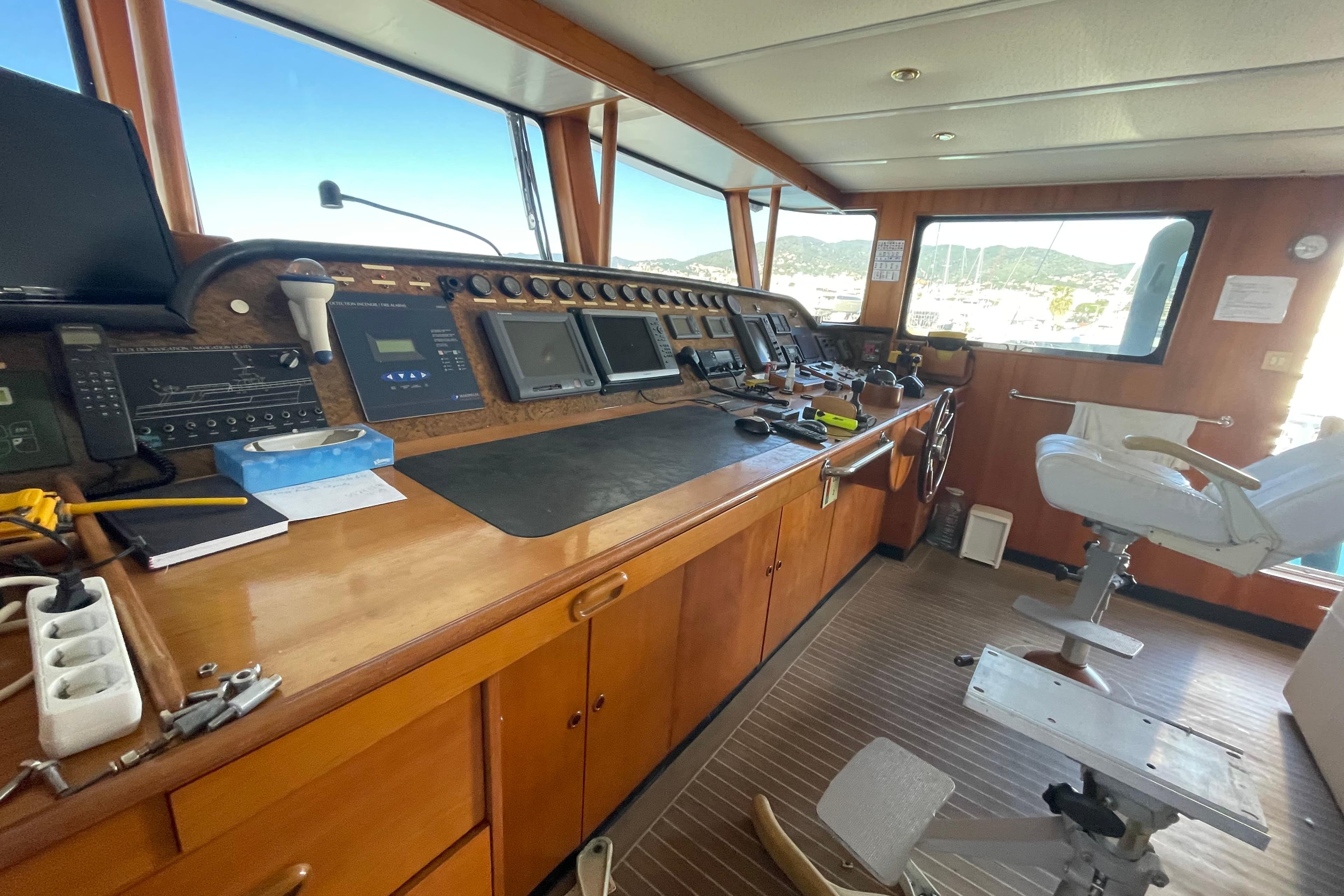 Cockpit of 2005 ATB Shipyards ATB Maroc Custom 28.8 with navigation equipment and captain's chair.