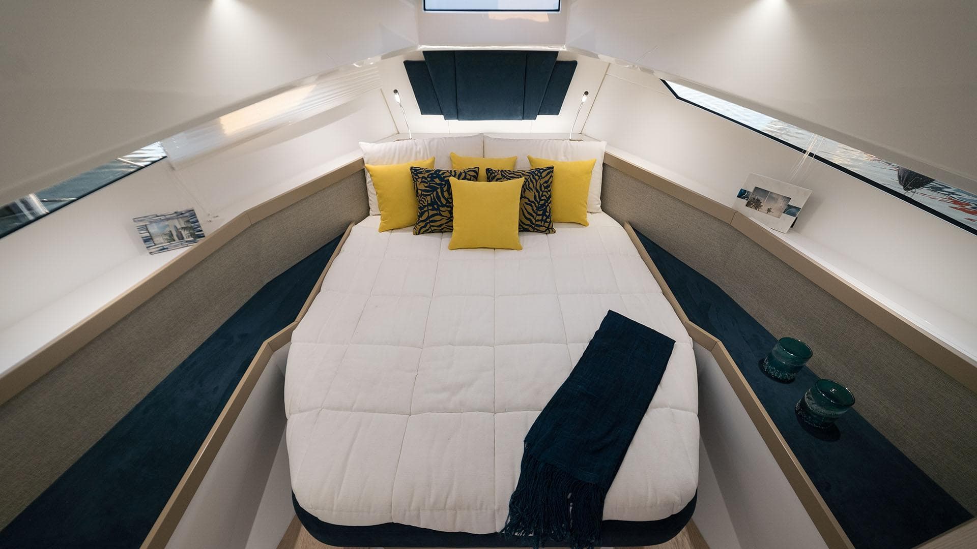 Luxurious cabin interior of the 2025 Fiart 35 Seawalker yacht with cozy bedding.