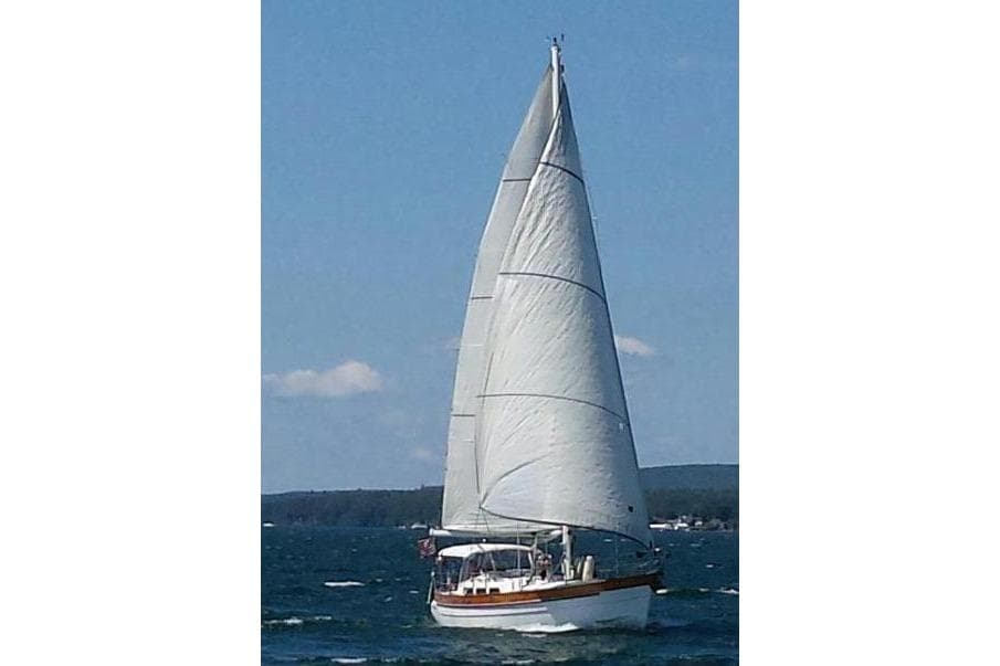 Sailing yacht Hans Christian Cristina 40, 1987, gliding on open water under clear skies.