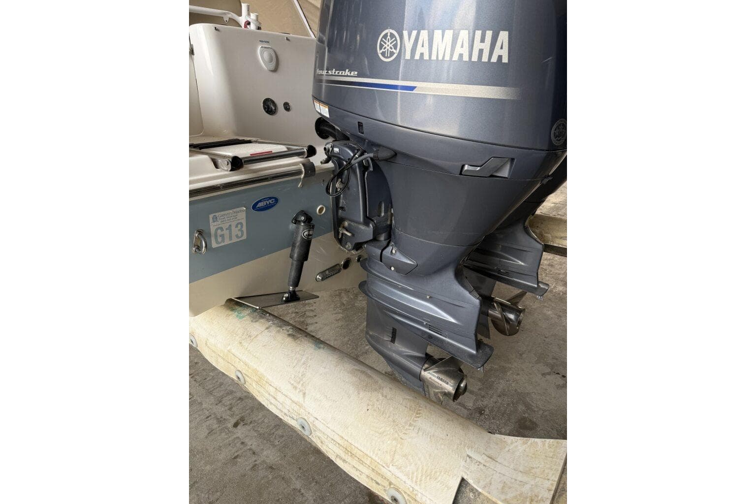 2018 Tidewater 252 CC Adventure with Yamaha outboard motor, docked on a trailer.