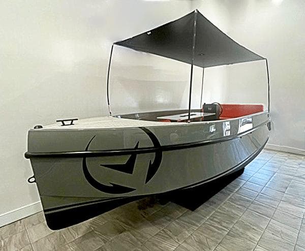 2024 Vision Marine Technologies Volt 180 boat with canopy, displayed indoors.