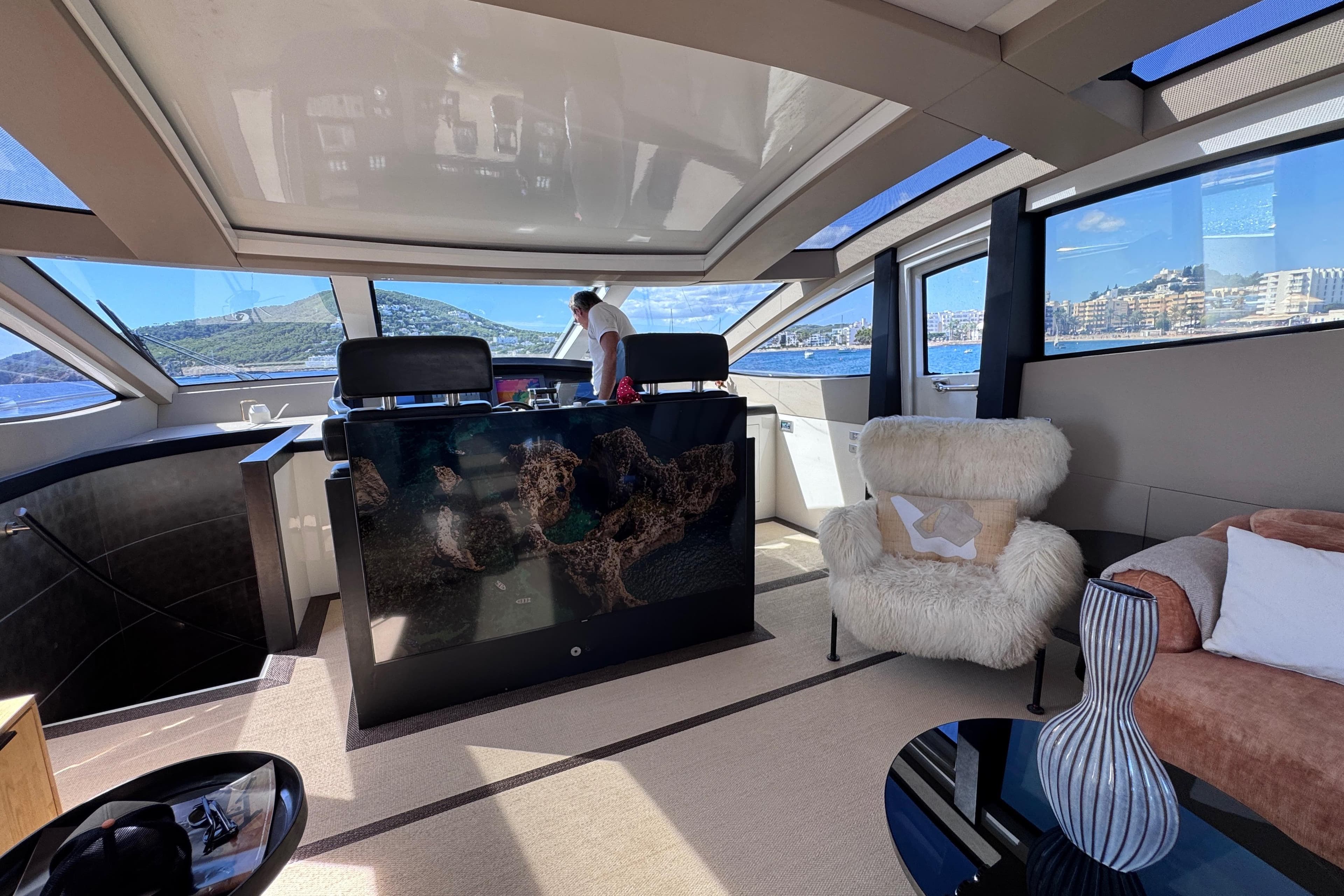 Luxurious interior of a 2010 Canados 90 yacht with modern furnishings and scenic views.