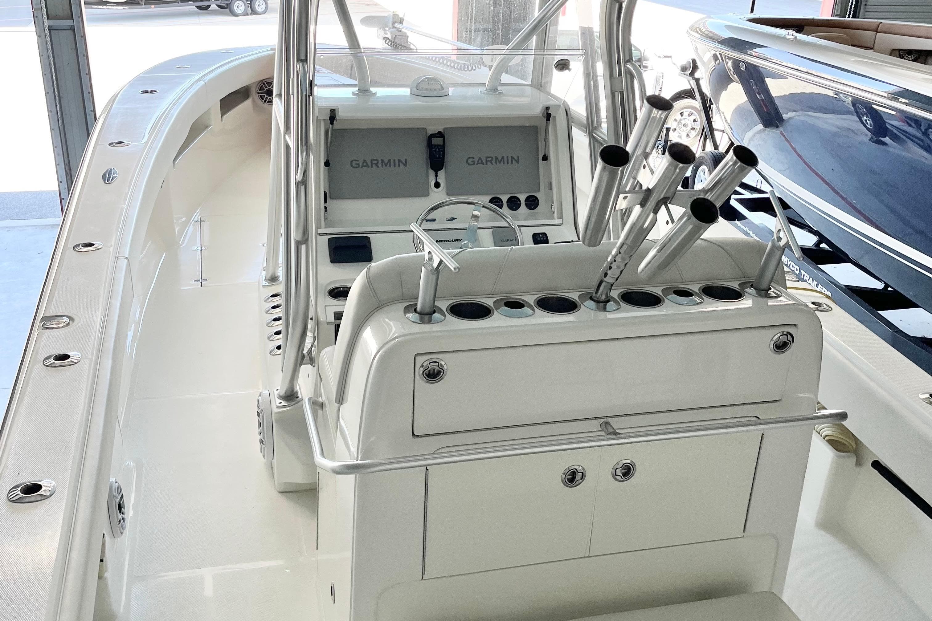 2021 SeaVee 340Z boat interior with Garmin navigation system and rod holders.