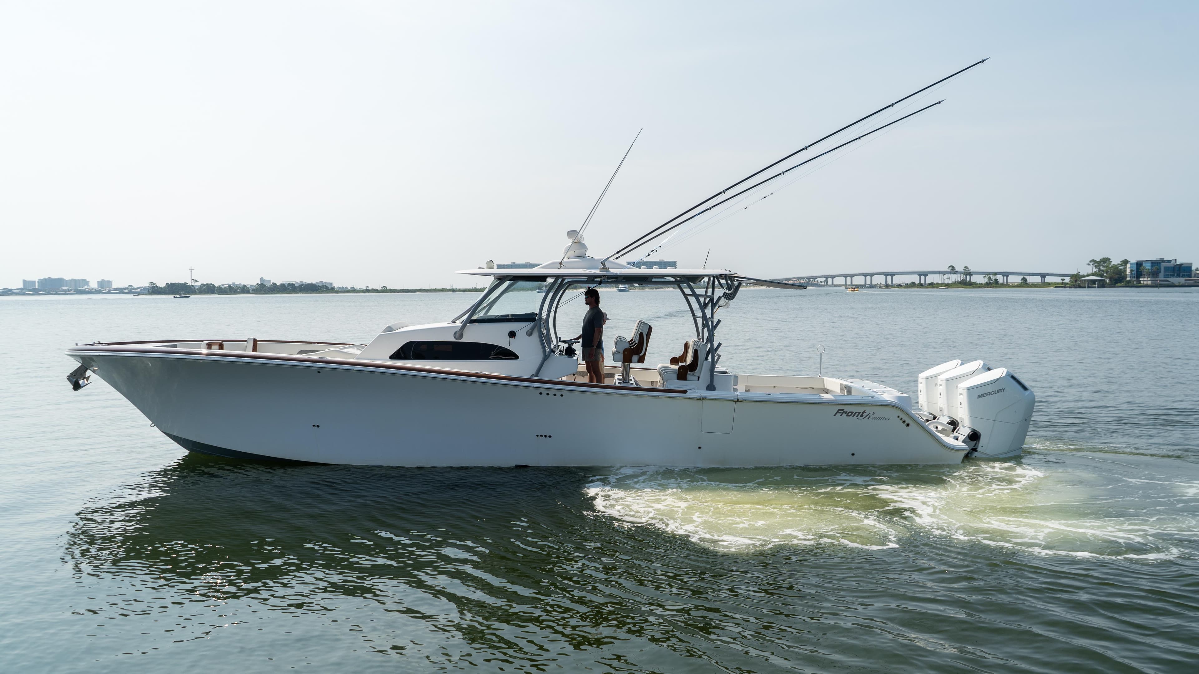 2023 Front Runner 47 Center Console boat cruising on calm water.