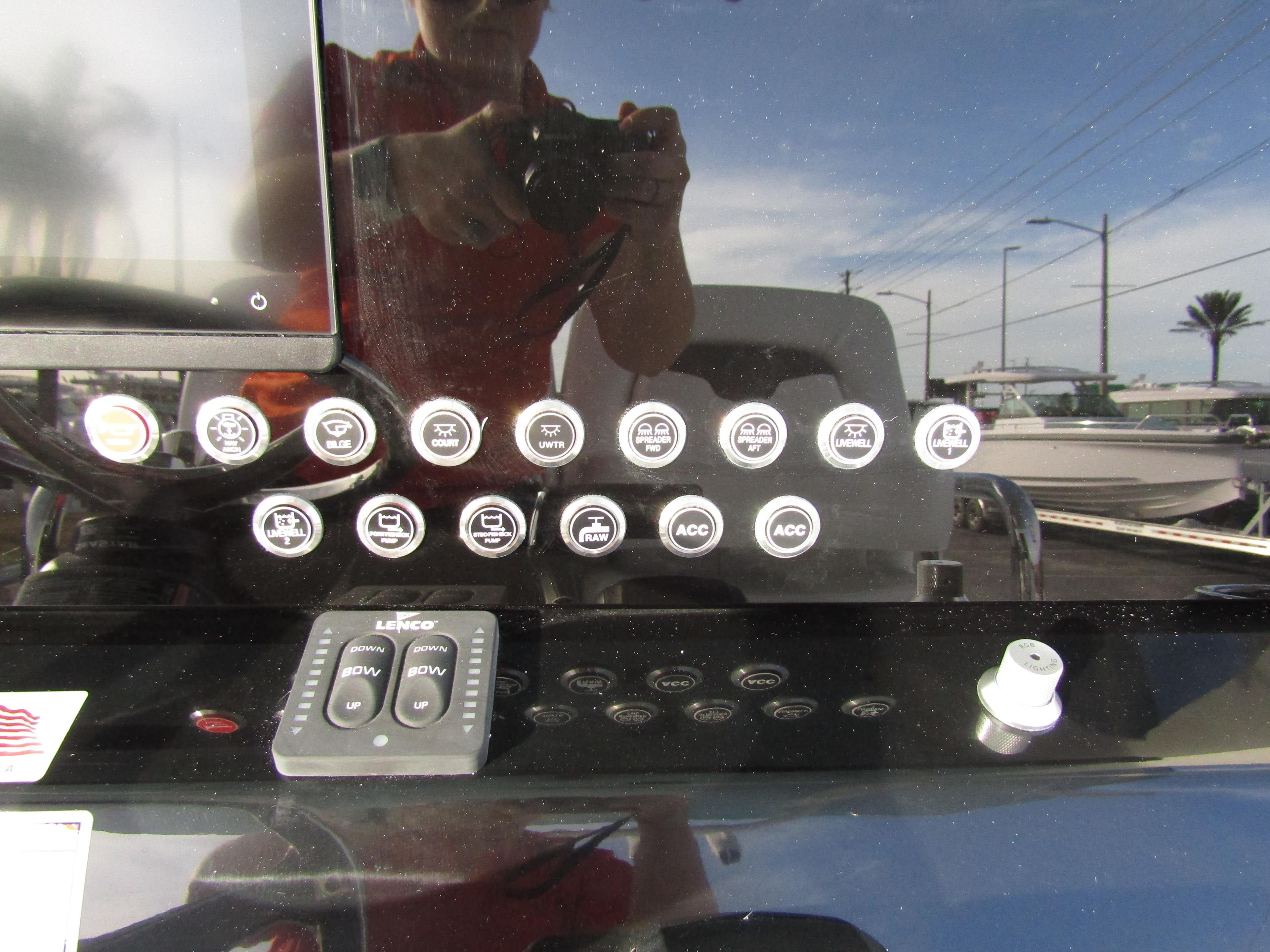 Control panel of 2025 Wellcraft 243 Fisherman boat with various buttons and switches.