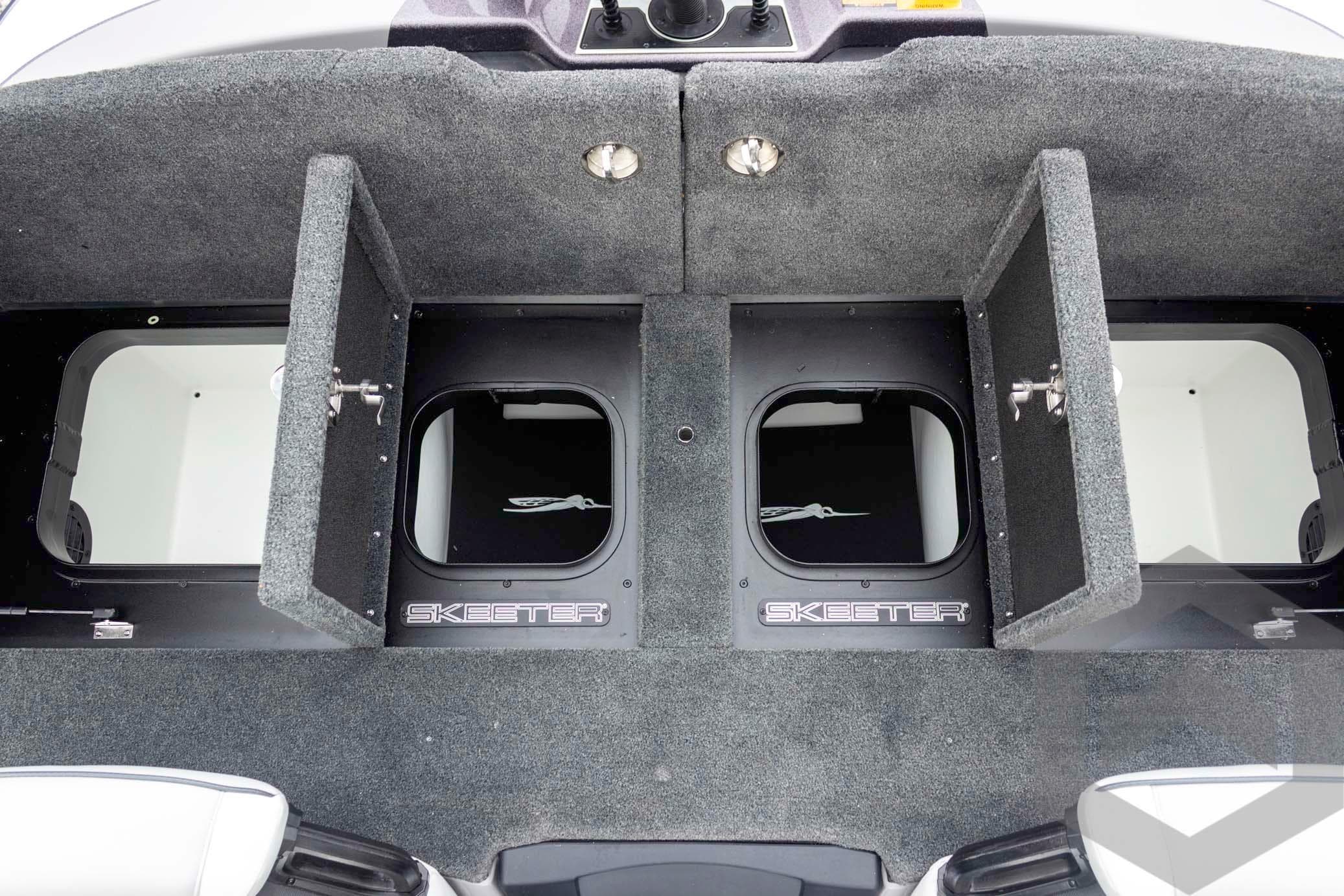 2026 Skeeter FXR20 FLEX boat storage compartments with open lids, showcasing interior space.