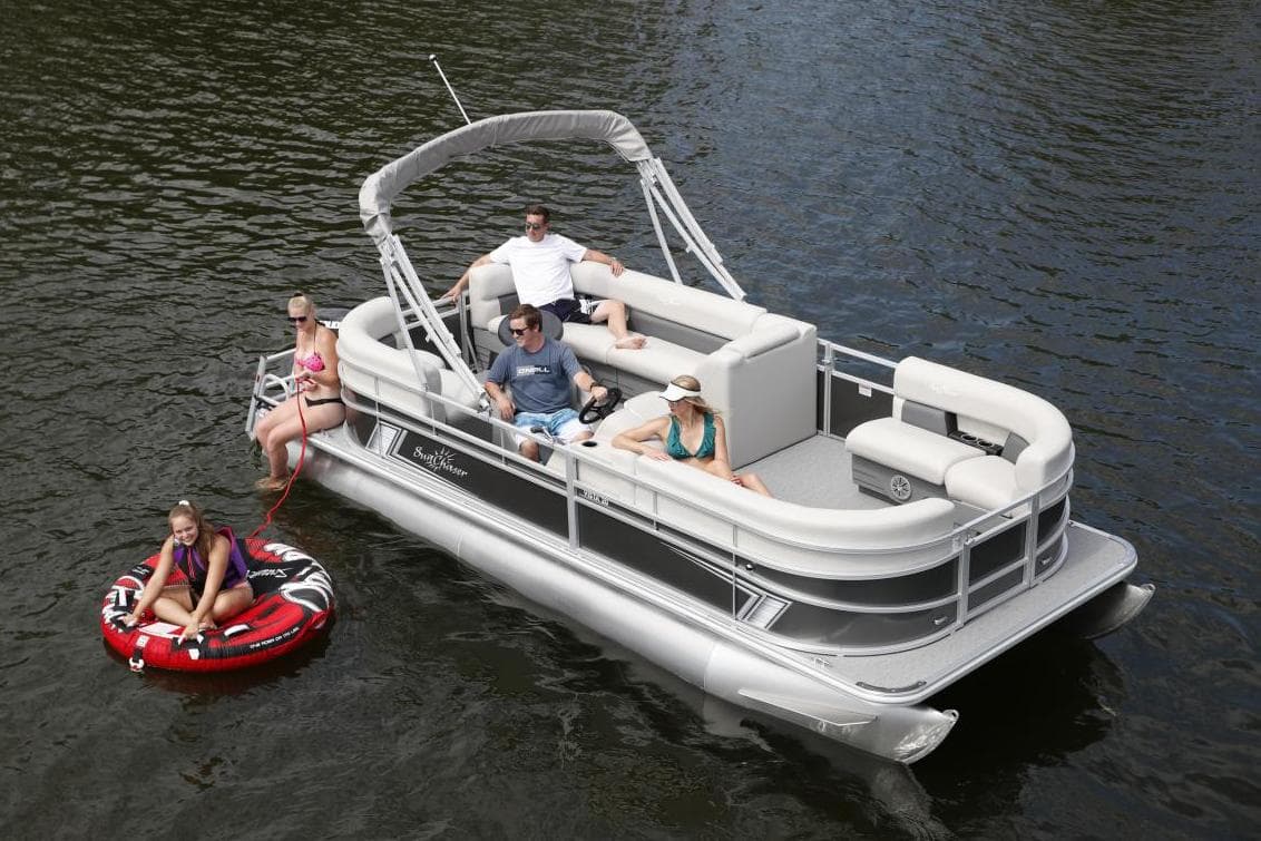Manufacturer Provided Image: 2024 SunChaser Vista 18 LR pontoon boat on water with people relaxing and tubing.
