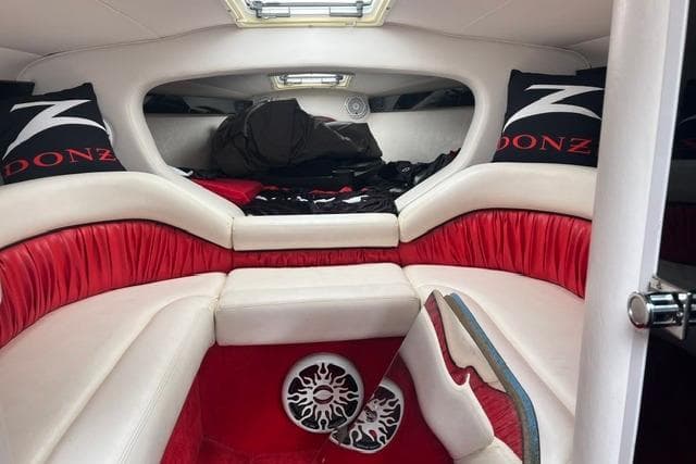 Interior of a 2000 Donzi 33 ZX boat with red and white seating.