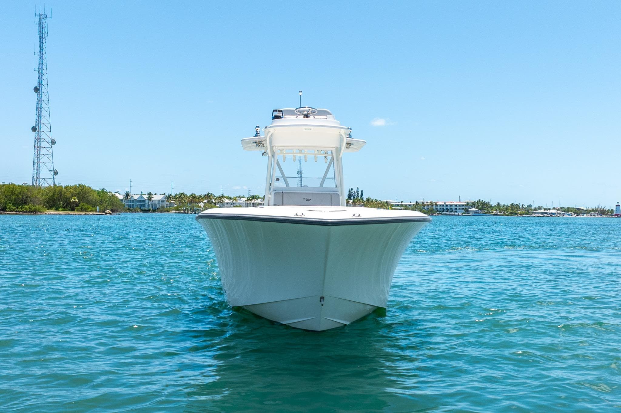 2025 SeaVee 322Z boat on clear blue water, front view.