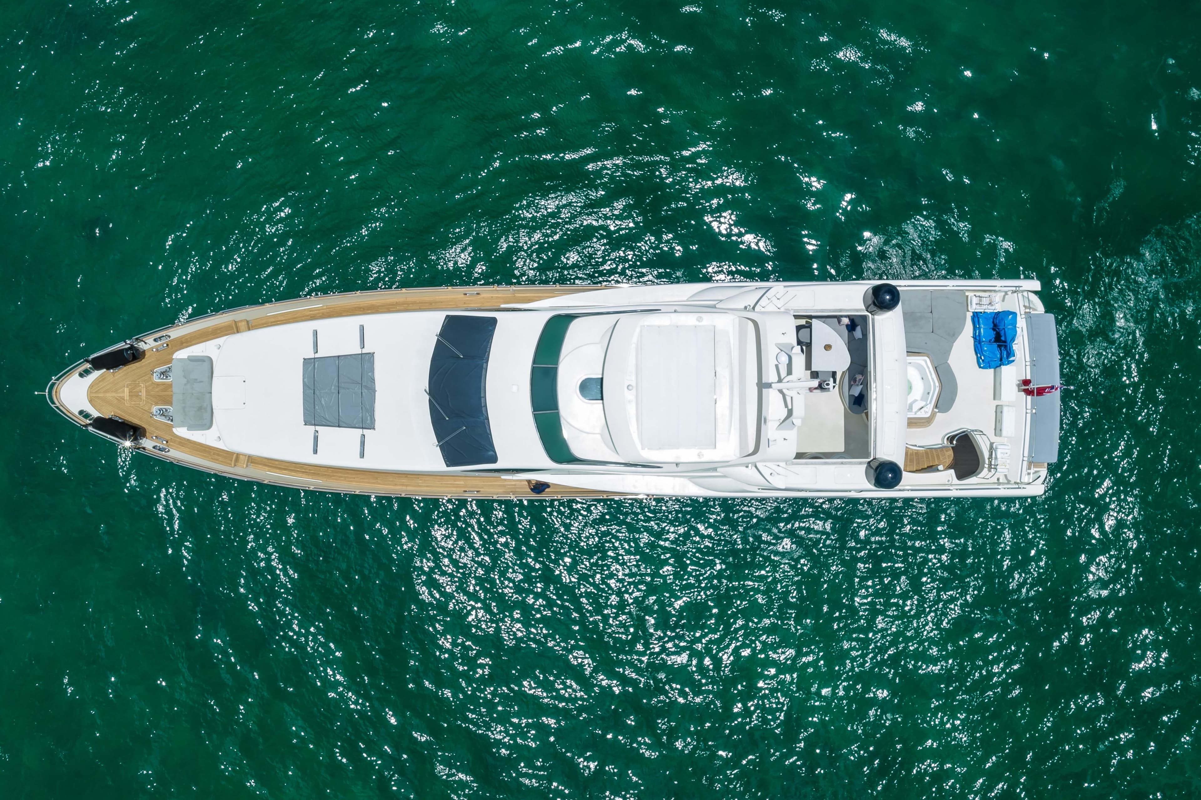 Aerial view of 2012 Azimut yacht on clear turquoise water.
