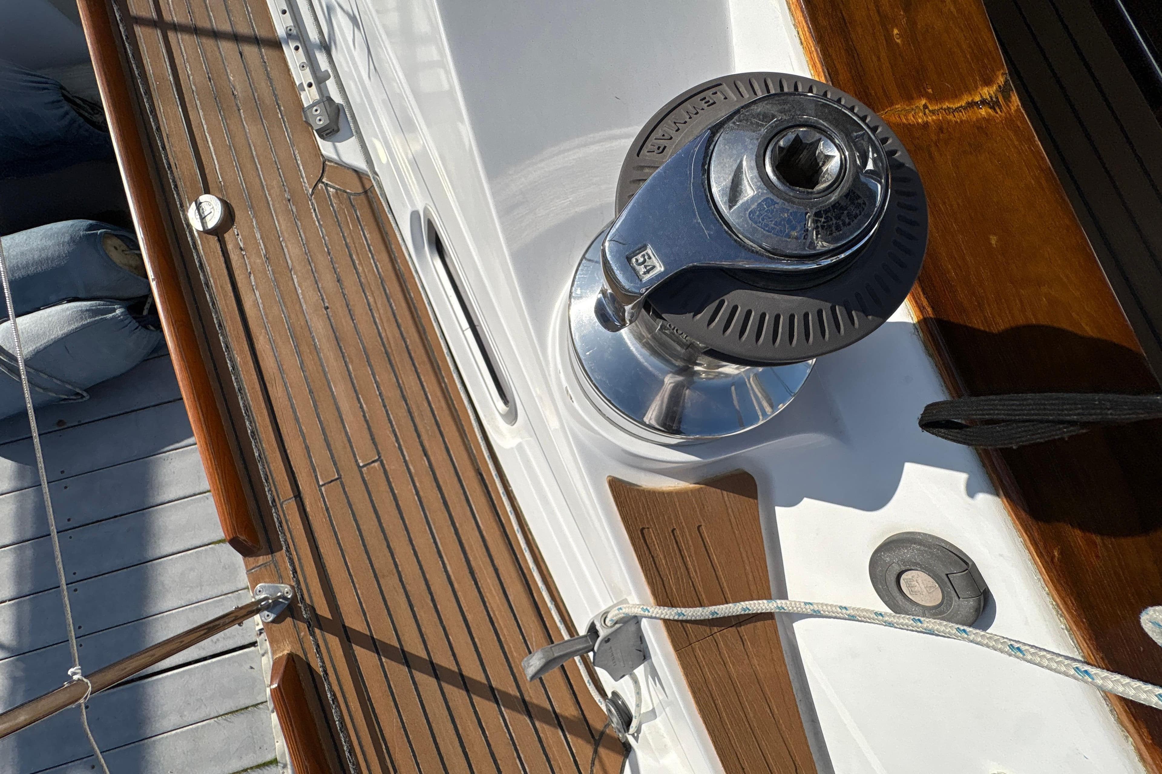 Deck of 2001 North Wind 56 yacht featuring a winch and teak wood finish.