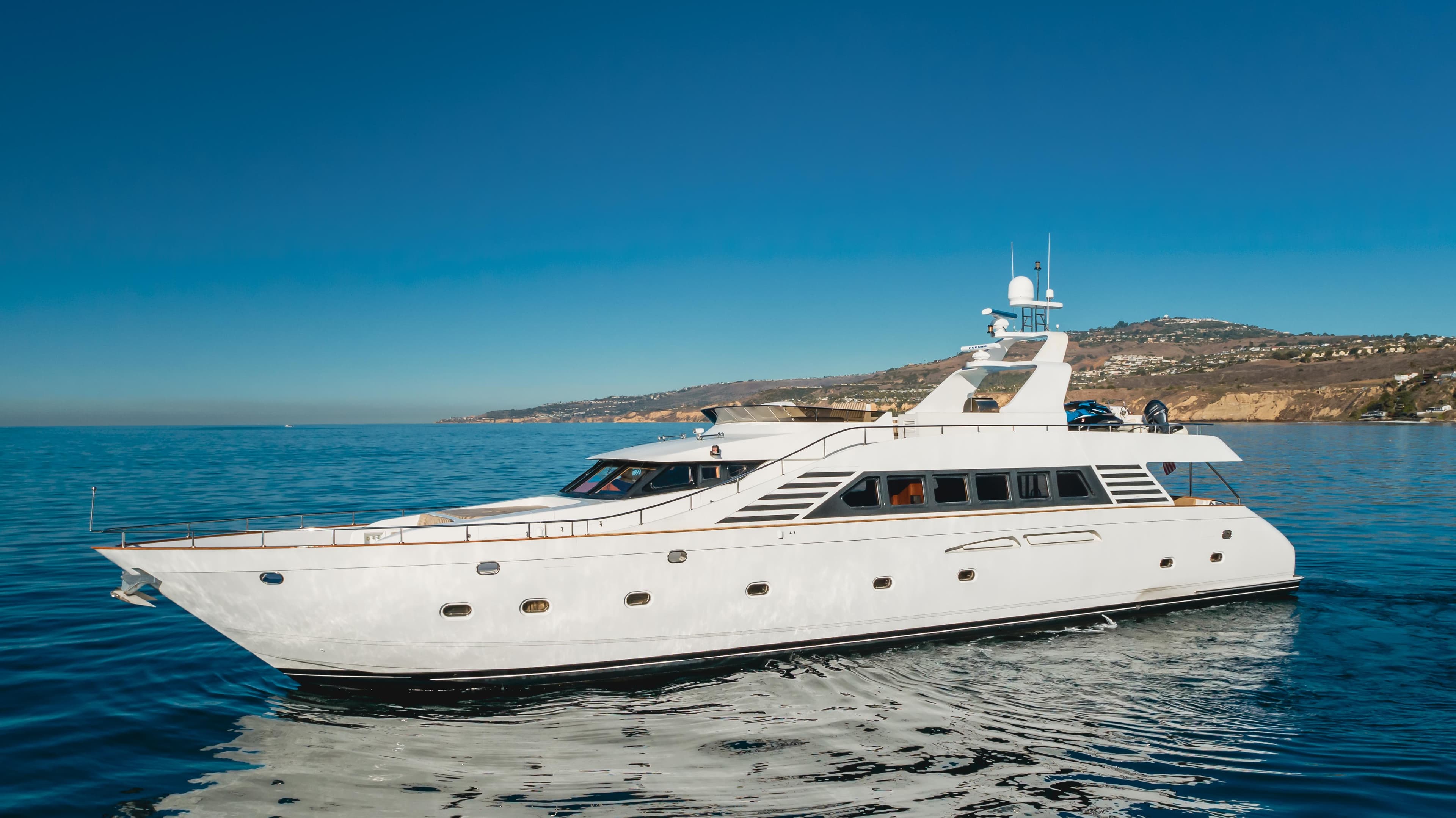 Luxurious 2003 TransWorld CUSTOM yacht cruising on clear blue waters.