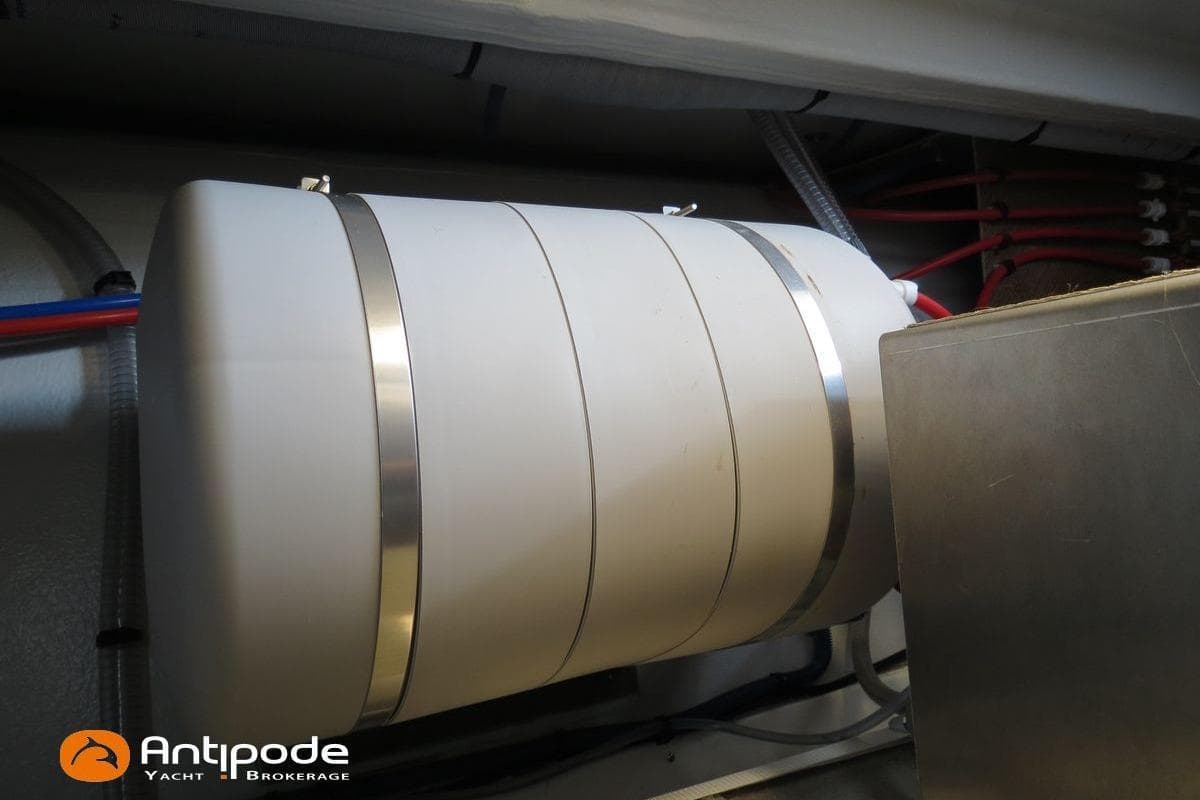 Water tank installation in a 2022 NEEL 43 yacht, featuring secure metal straps.