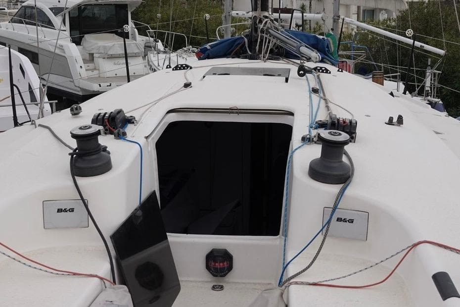 2015 Sydney 43 GTS sailboat deck with winches and open hatch.