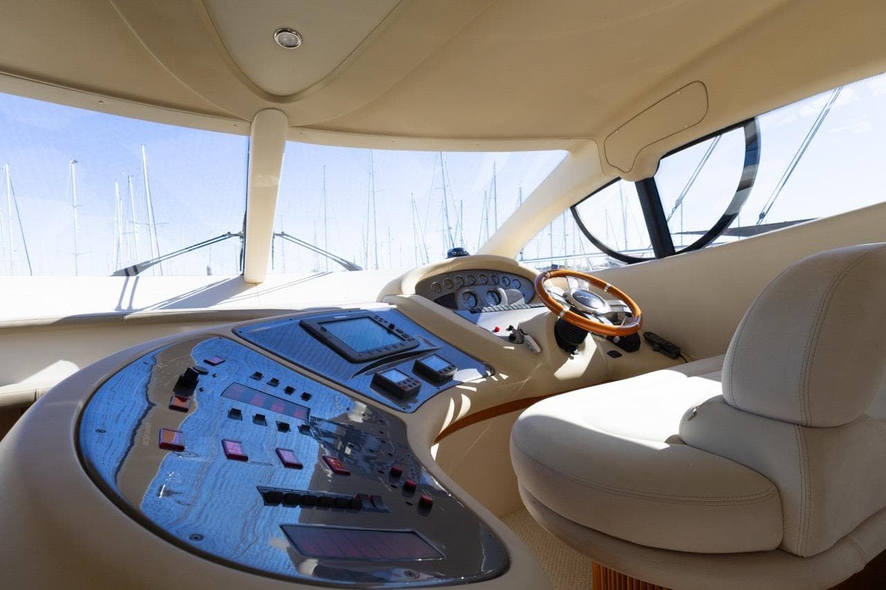 Luxurious 2005 Azimut 46 yacht cockpit with modern controls and plush seating.